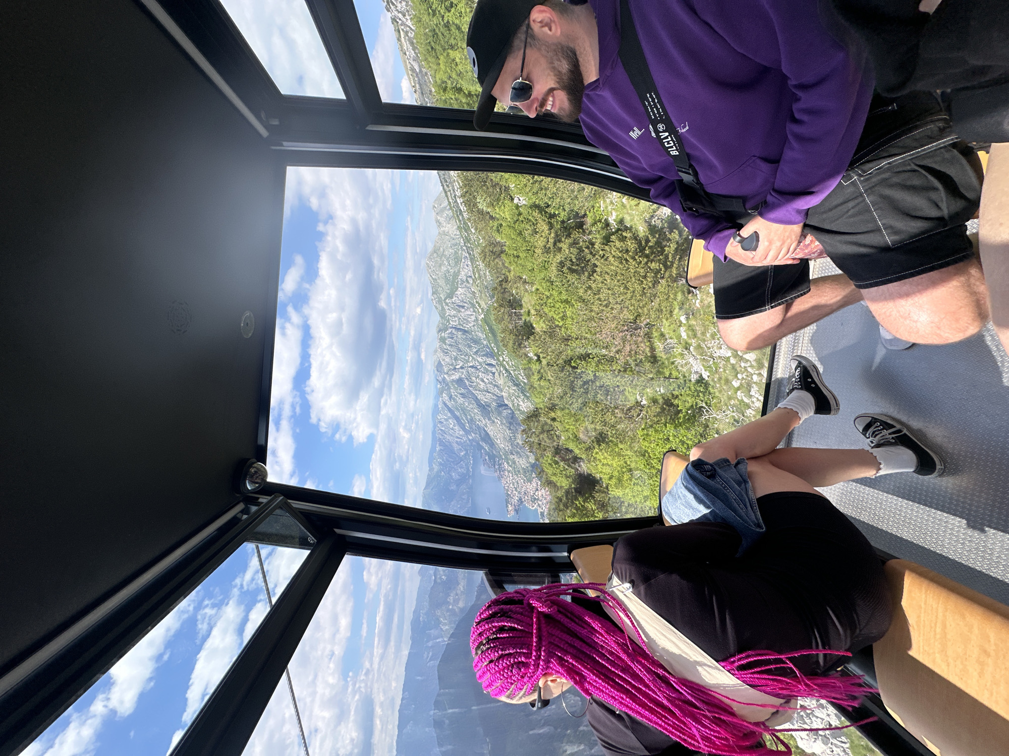 Cable car riders capture scenic Bay of Kotor views