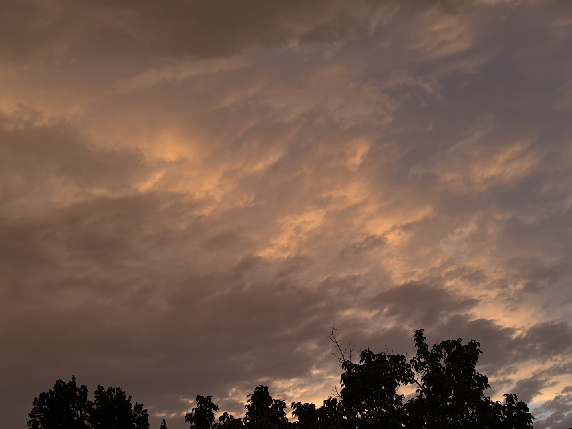 Vivid sunset clouds fill the sky above Chirchik, Uzbekistan