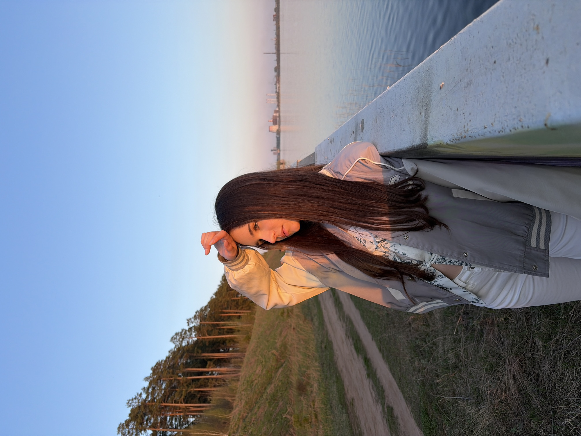 Woman photographed at sunset near Izhevsk Pond, Russia