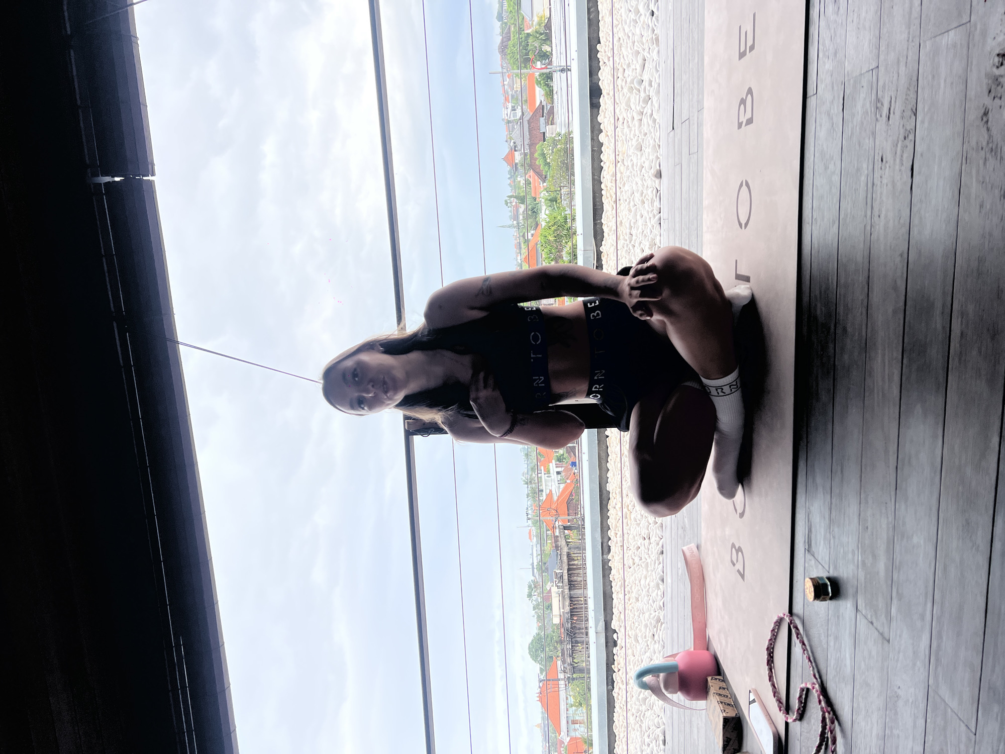 Woman practices yoga indoors in Mengwi, Indonesia