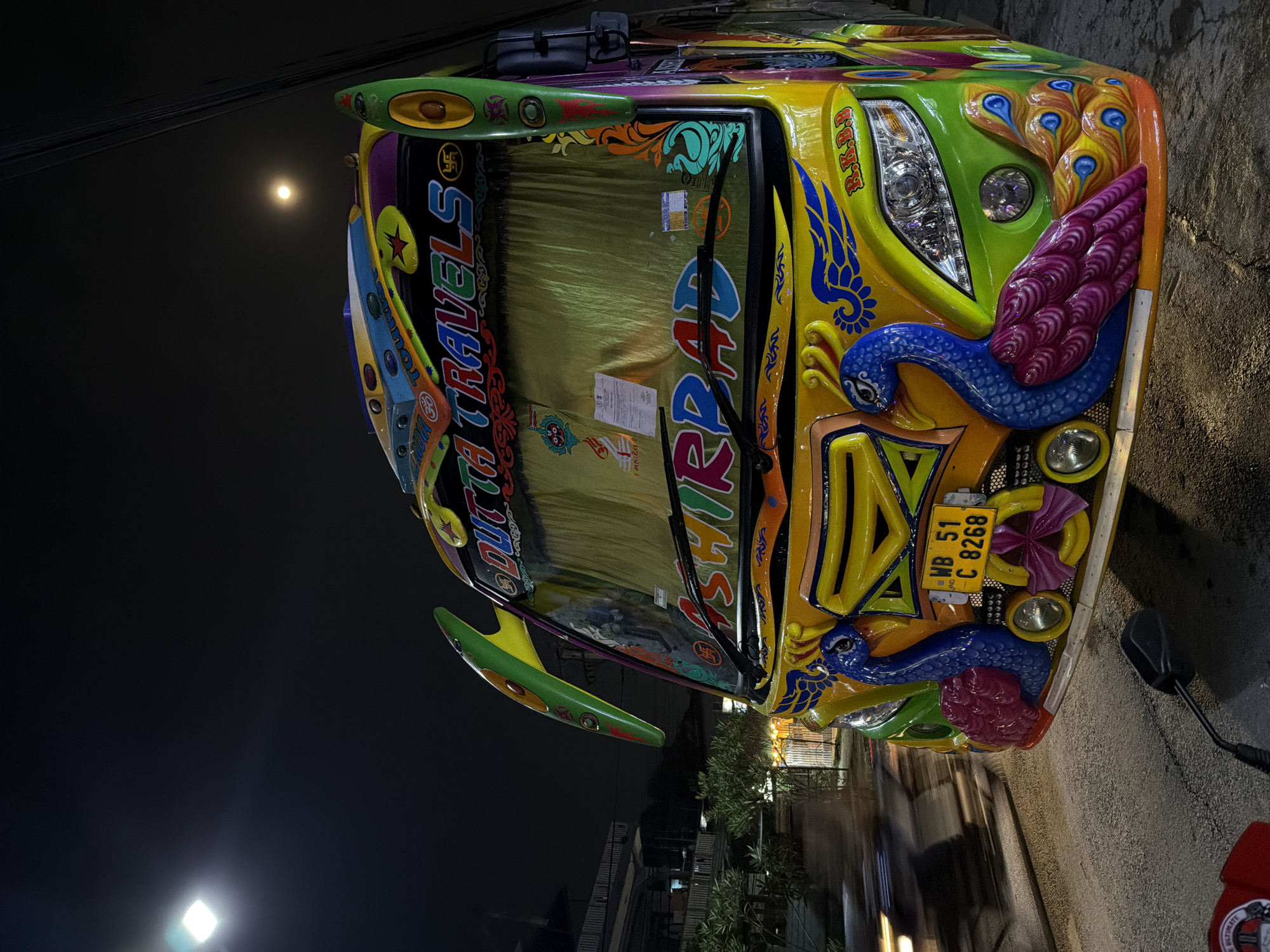 Decorated Nepali bus spotted in Pokhara streets under full moon