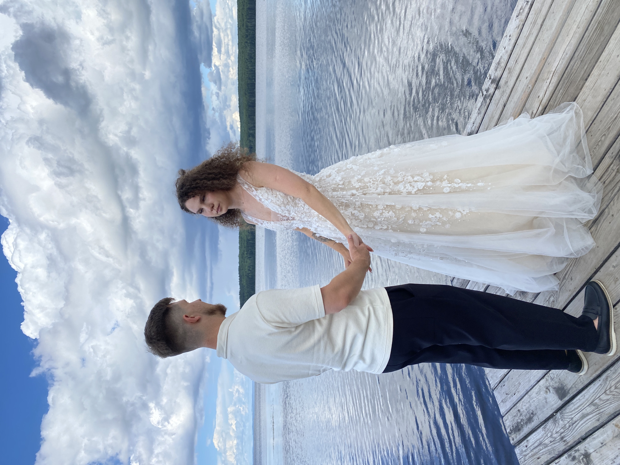Wedding shoot on a lakeside pier in Chaikovsky, Russia