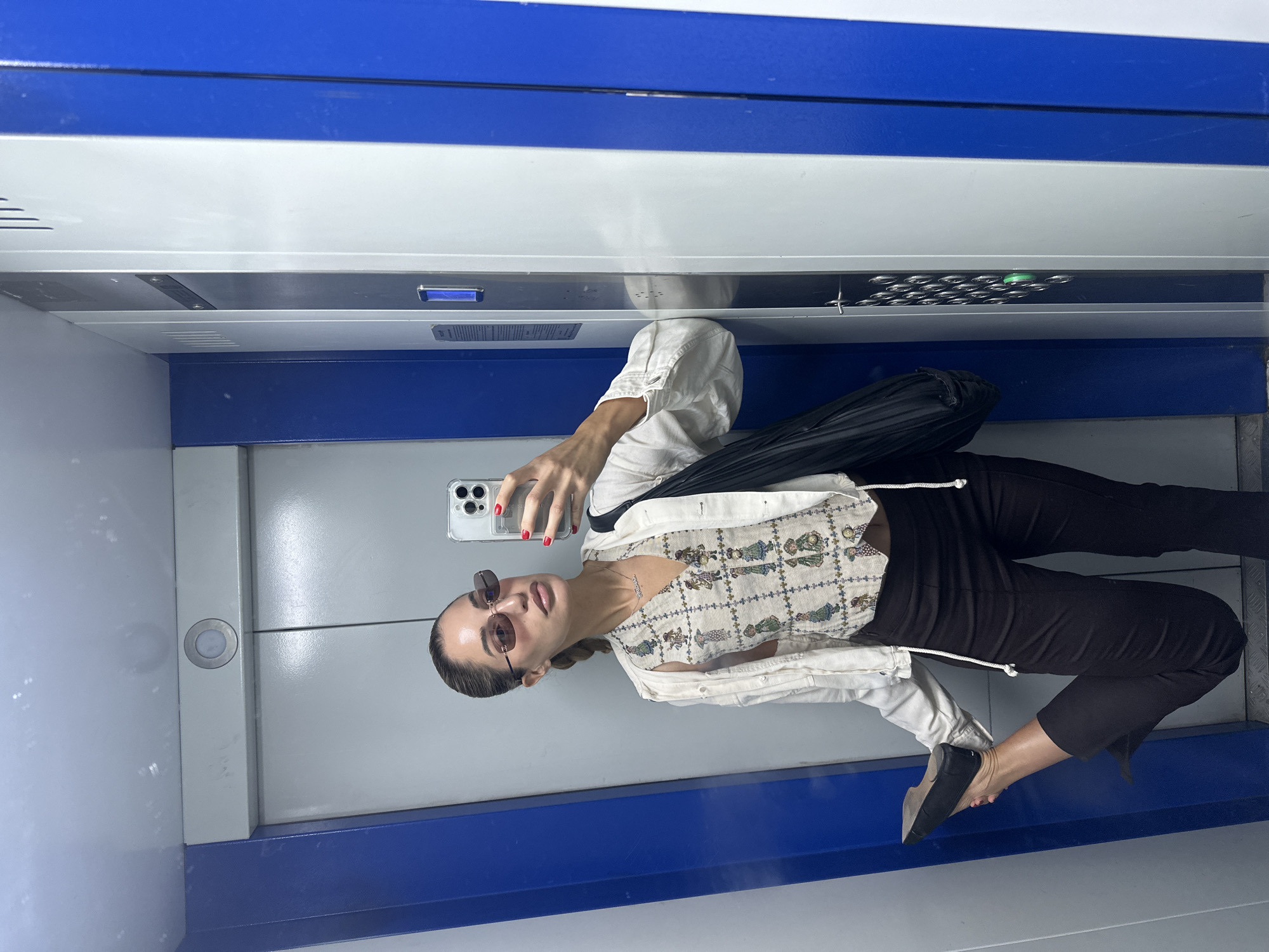 Elevator selfie moment in Moscow, styled and ready to go