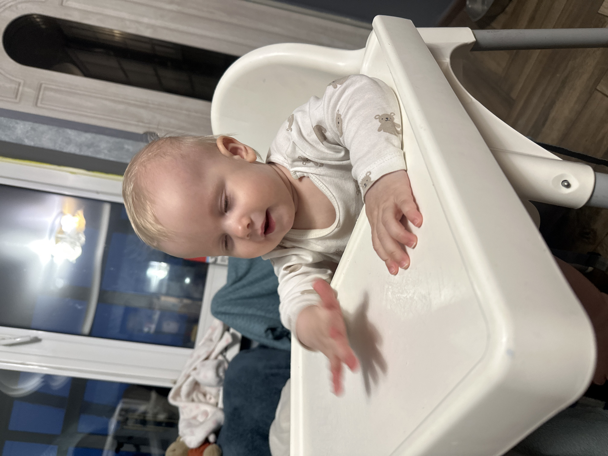 Russian parent makes dumplings while tending baby in Pokrov