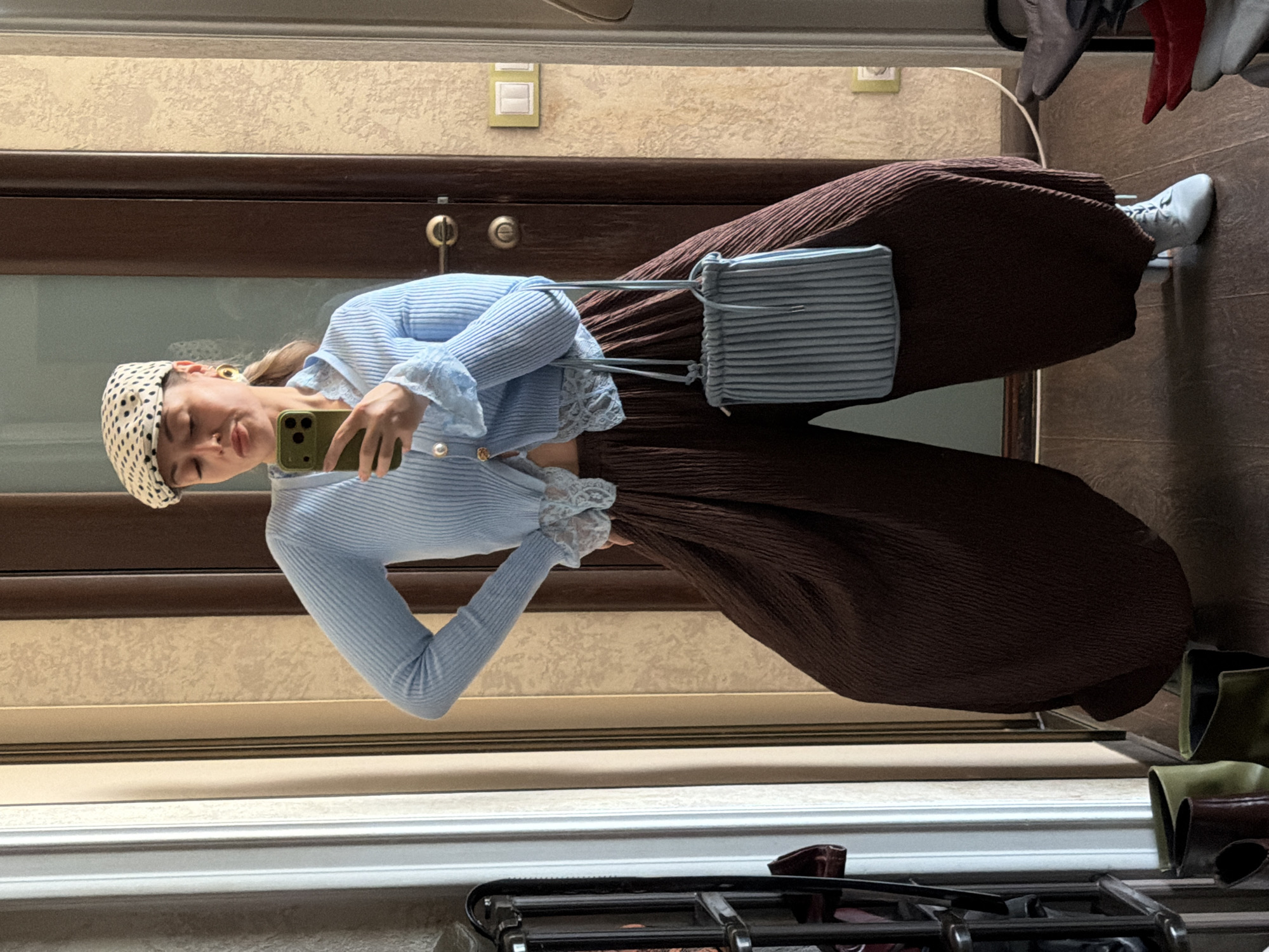 Woman takes mirror selfie indoors in Krasnoyarsk, Russia