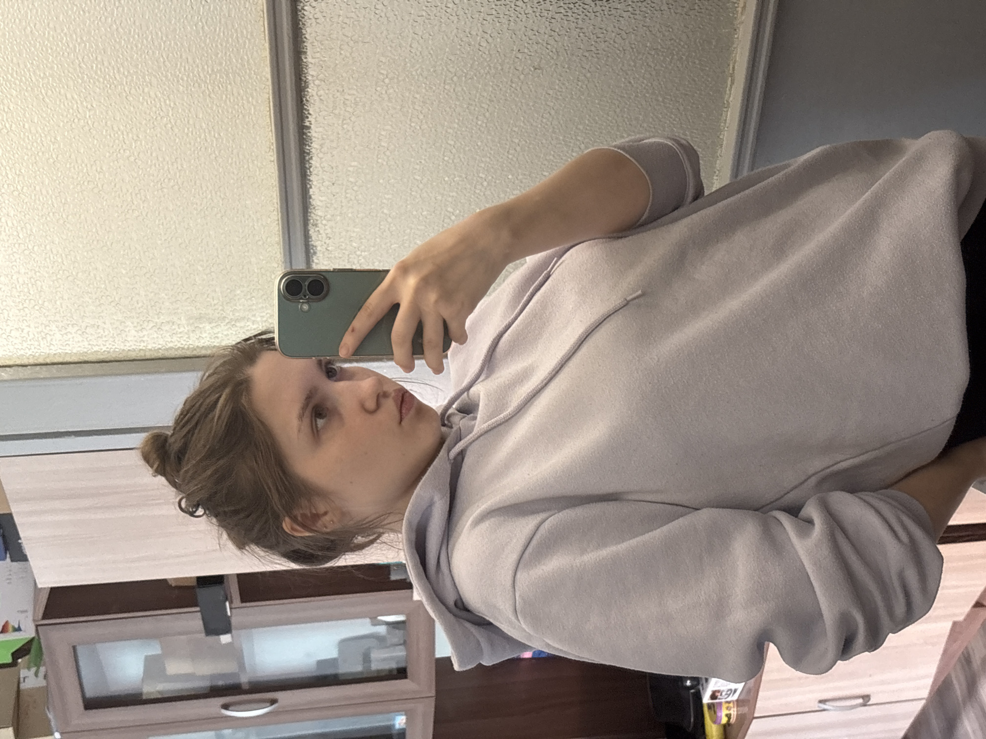 Woman documents morning selfies, plant care, breakfast in St. Petersburg