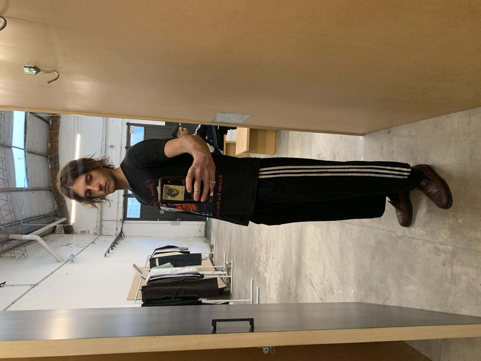 Young men take selfies indoors in Buenos Aires