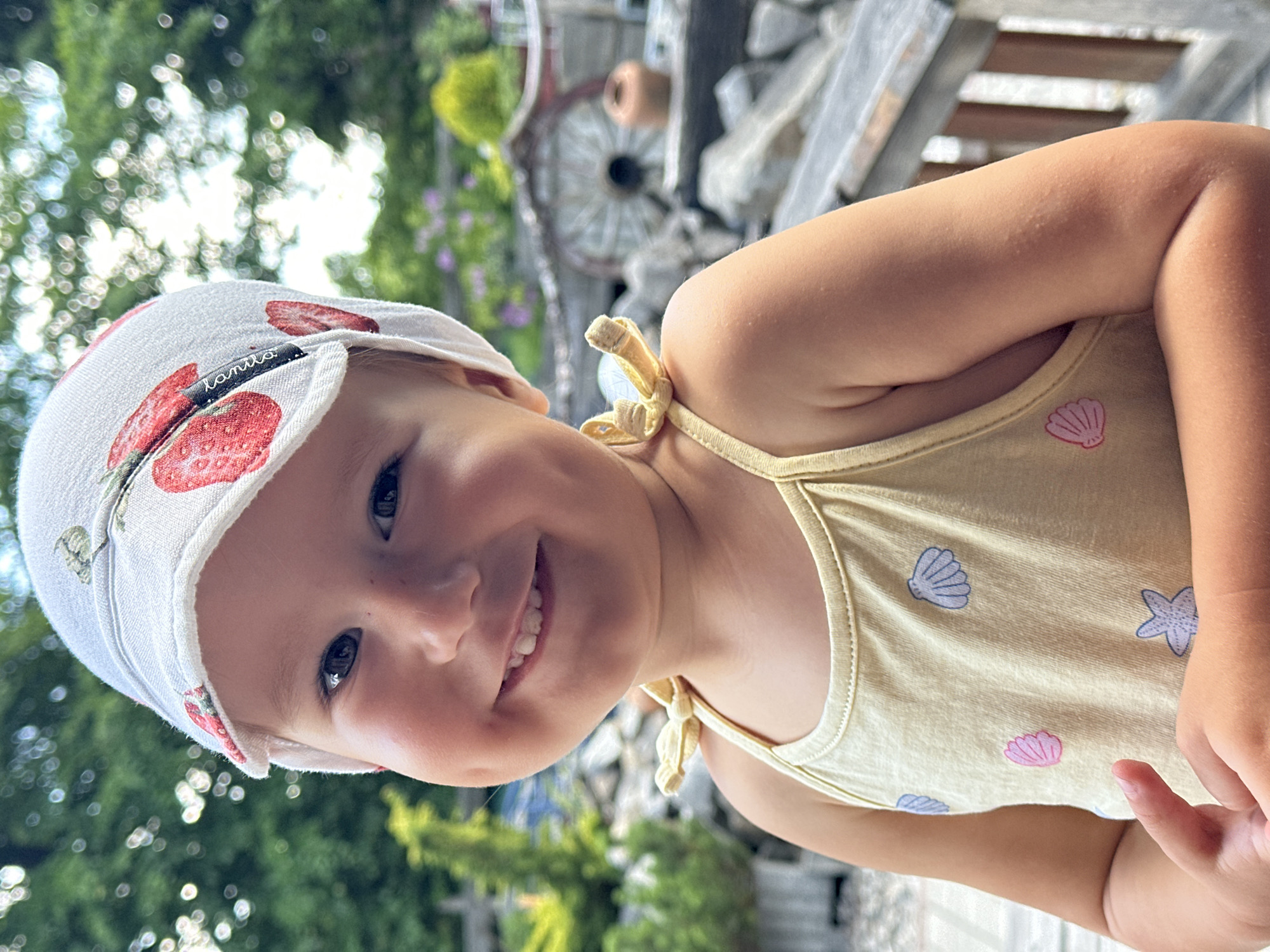Toddler on a sunny wooden deck in Wisła, Poland