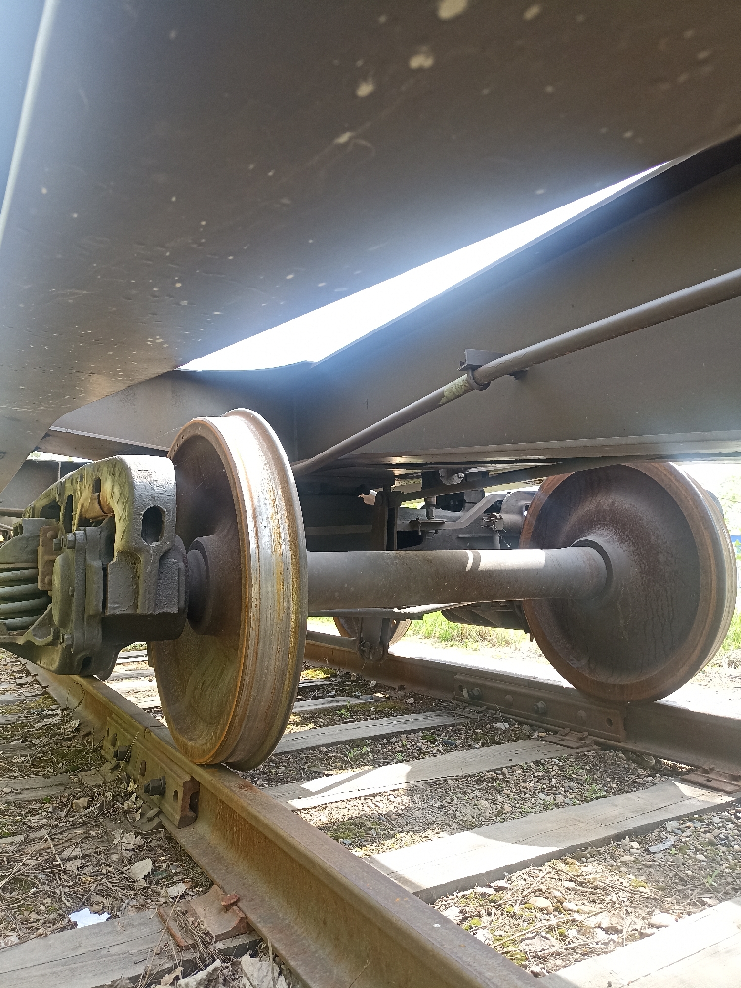 Railway car components and tracks documented in mixed urban area