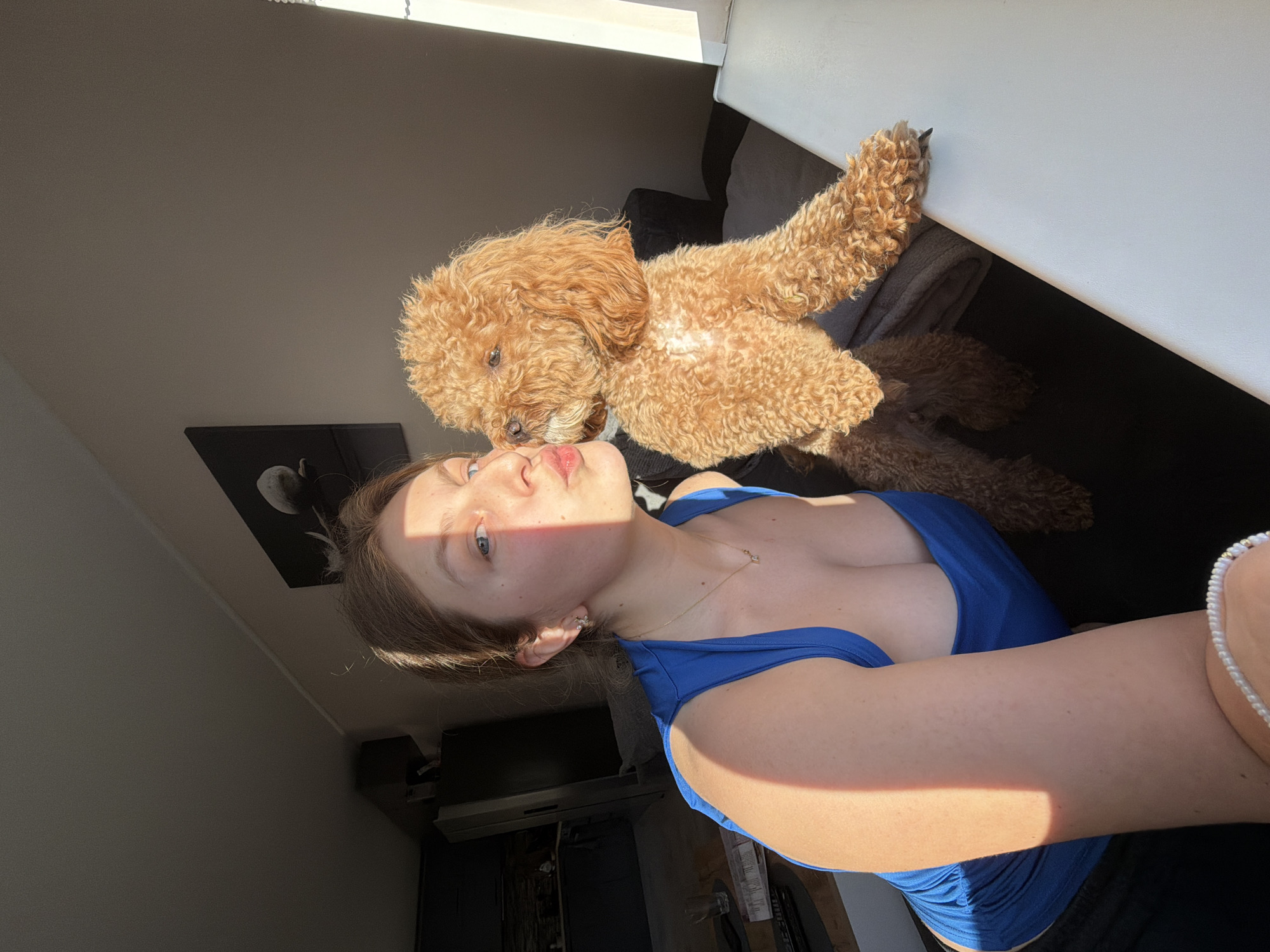 Woman takes leisurely selfies with poodle at Bulgarian home