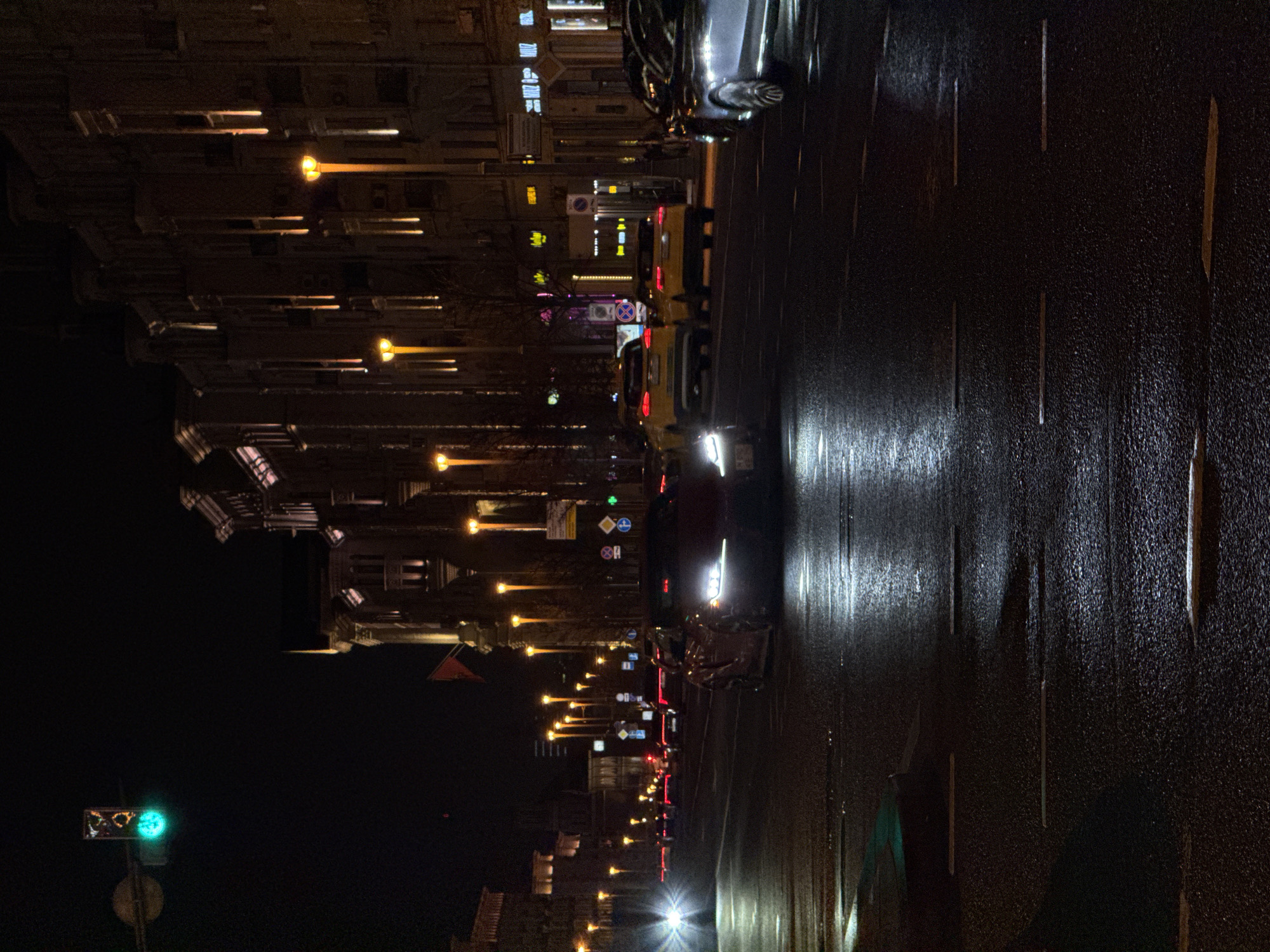 Moscow evening scenes show wet streets, classical architecture, holiday lights