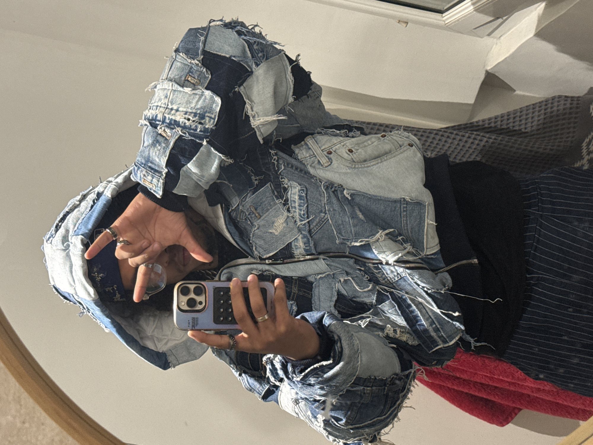 Person takes mirror selfie in denim jacket, Massy France
