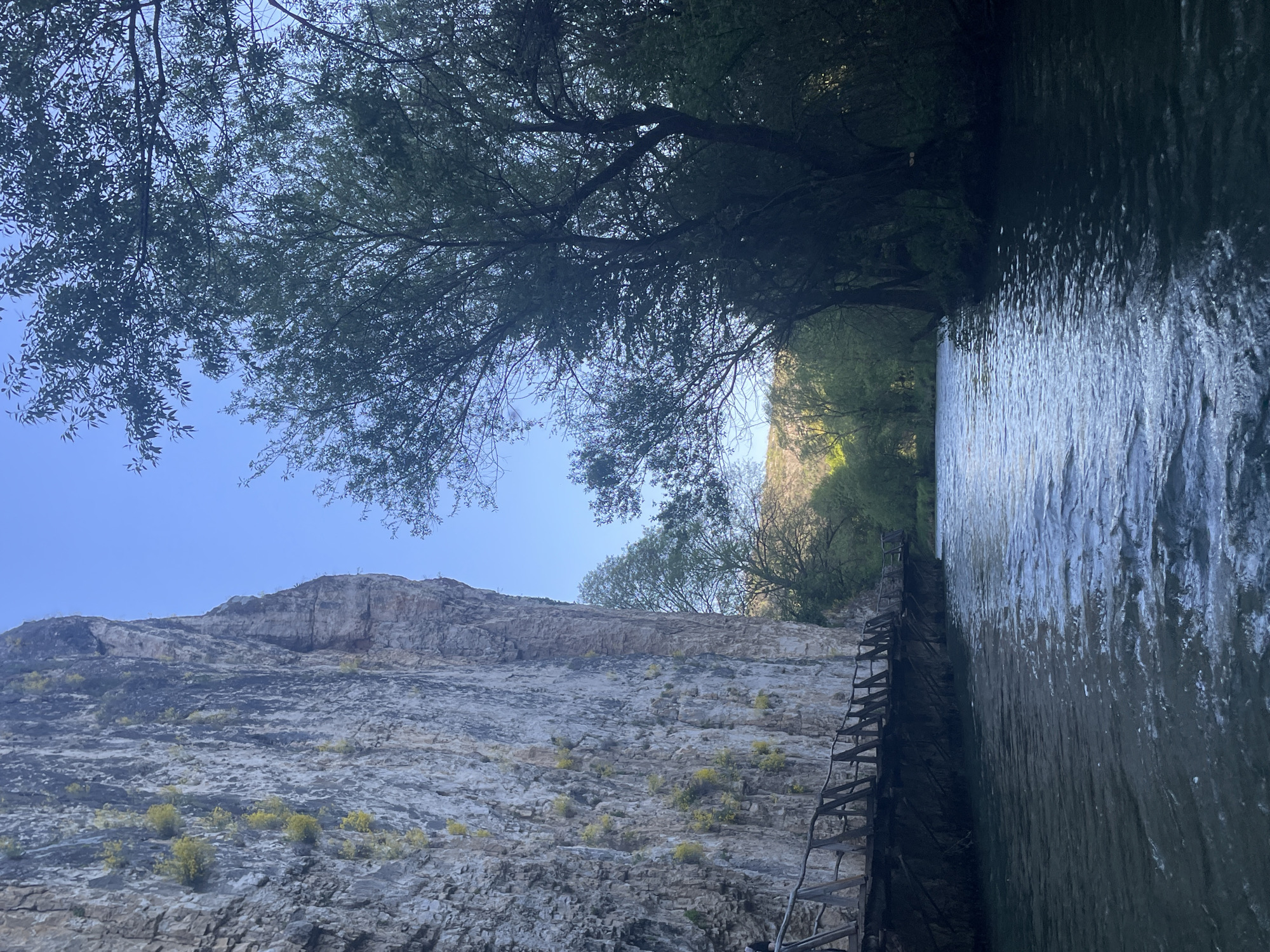 Visitor documents scenic Iskar River walkways near Petrevene, Bulgaria