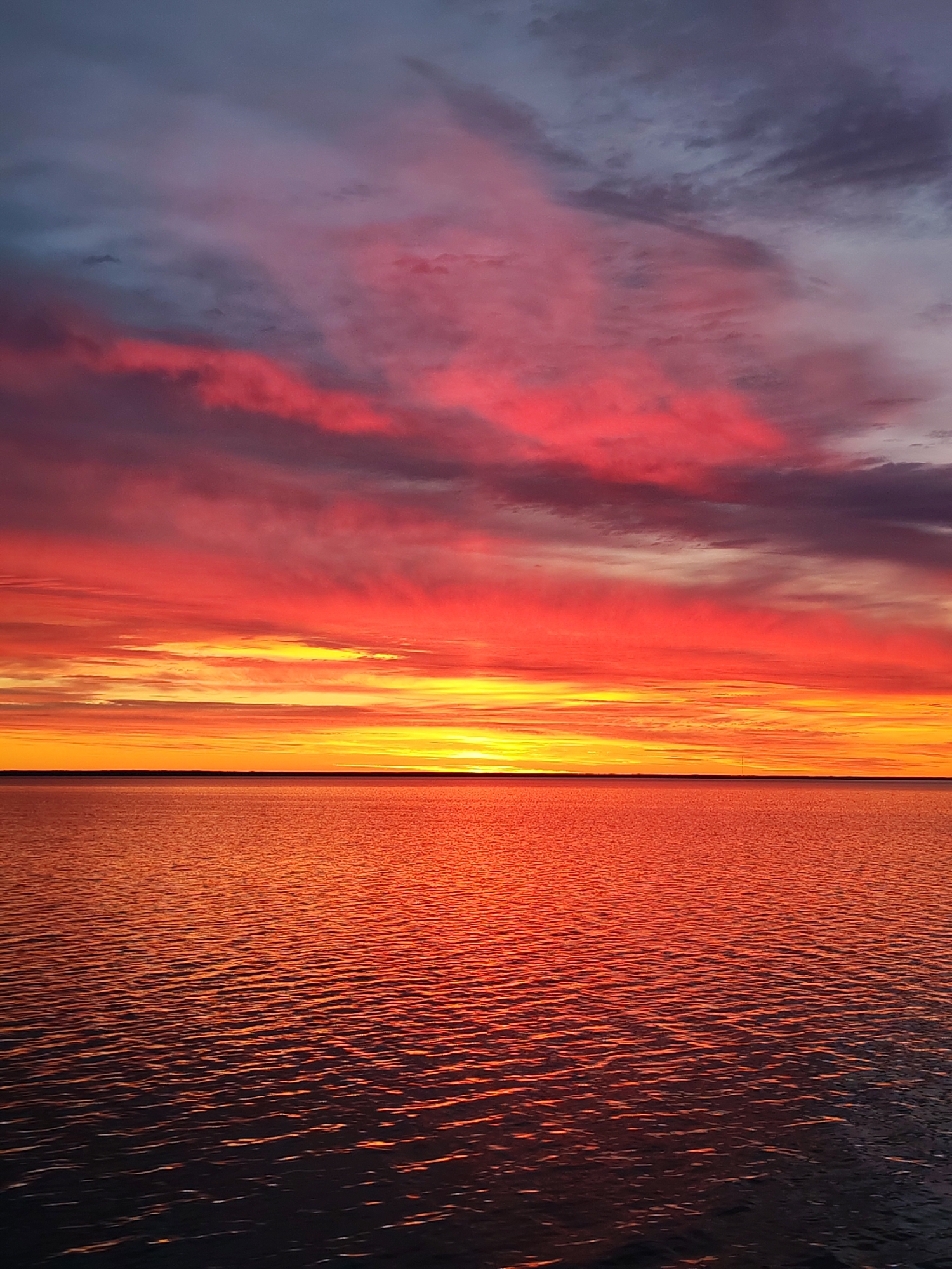 Vibrant sunset over Russian waters captured in photographs
