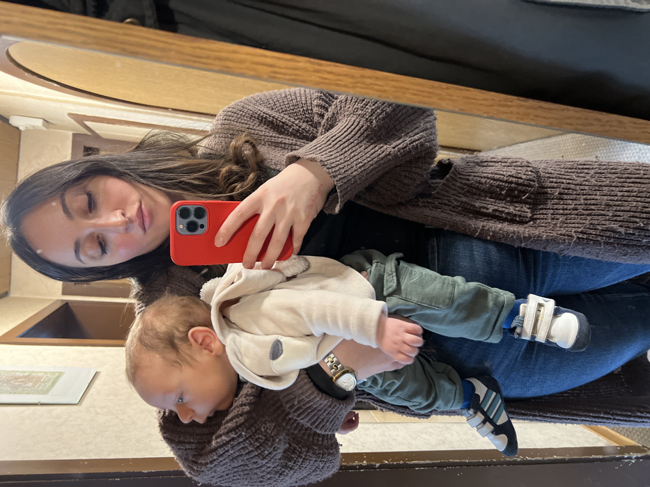 Mother holds infant during quiet moment in Wüstenrot, Germany