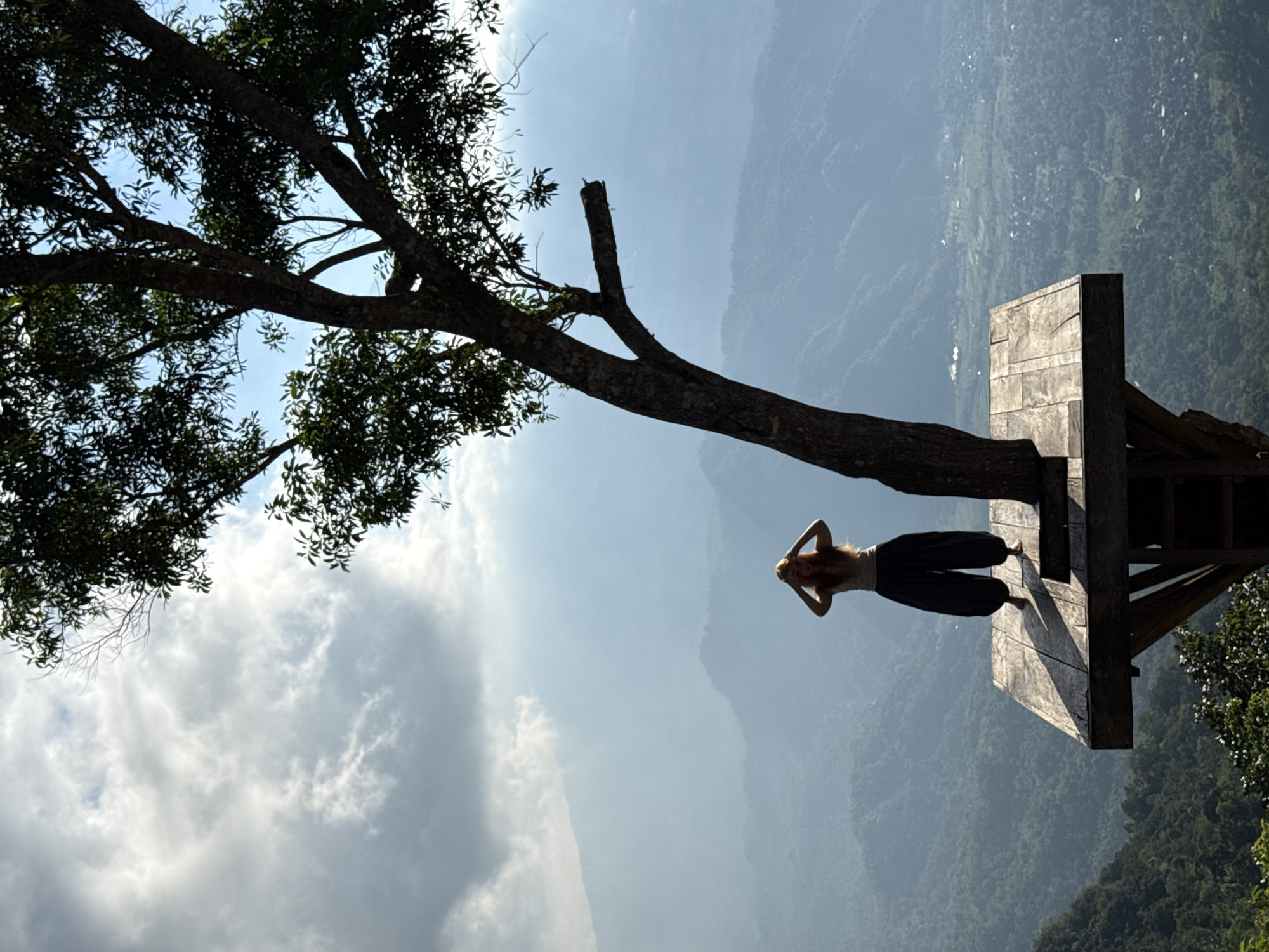 Treetop platform perch over a steep drop in Abang, Indonesia