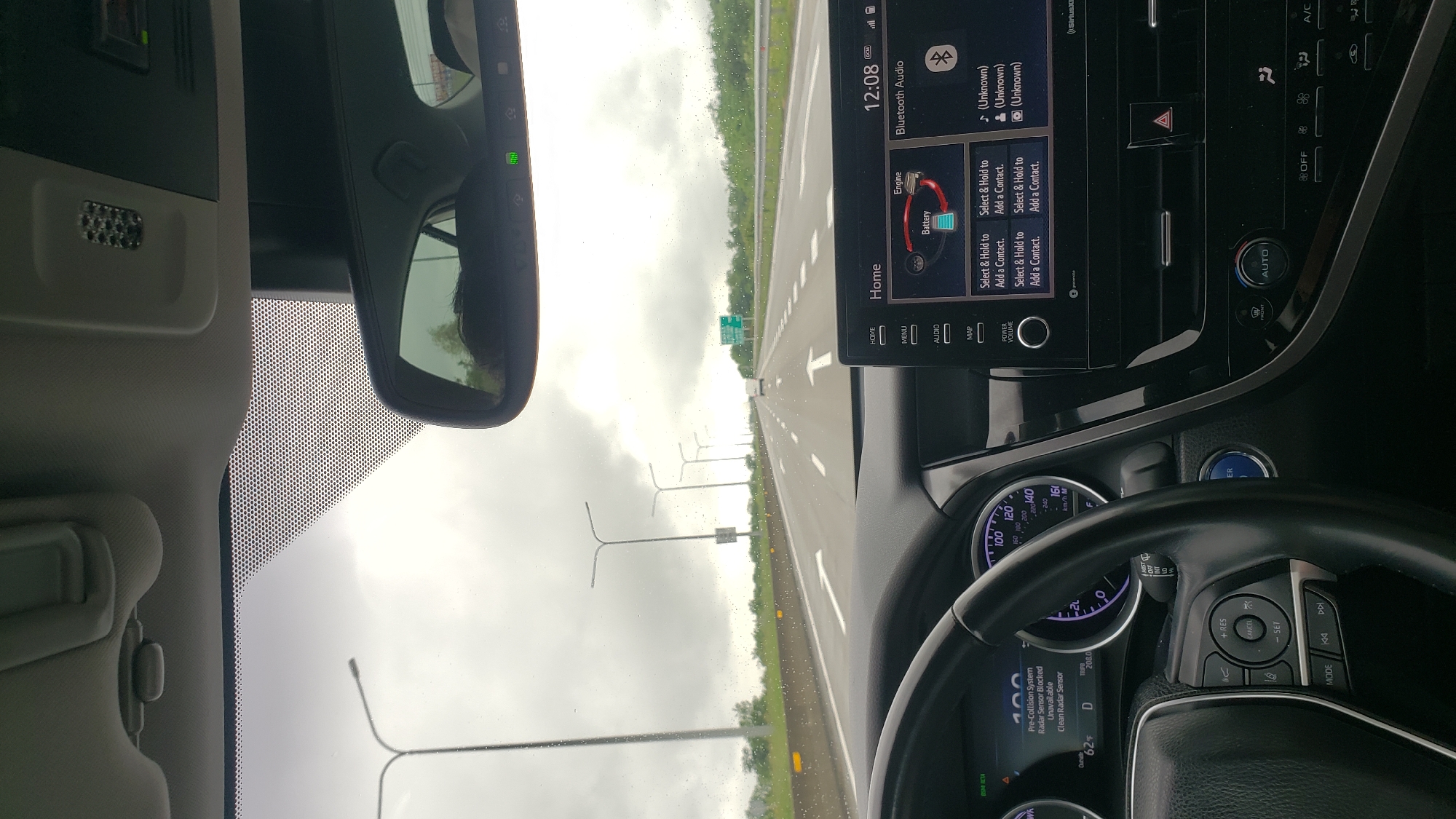 Driver documents highway journey through vehicle interior in Georgia