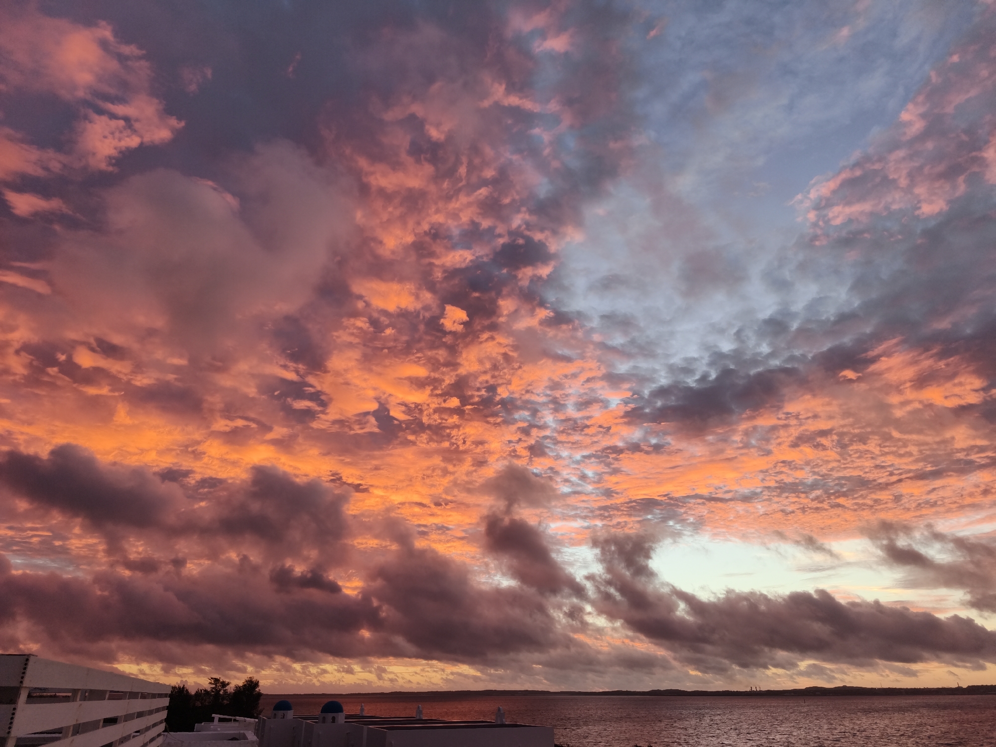 Vivid tropical sunset over Miyakojima's ocean horizon