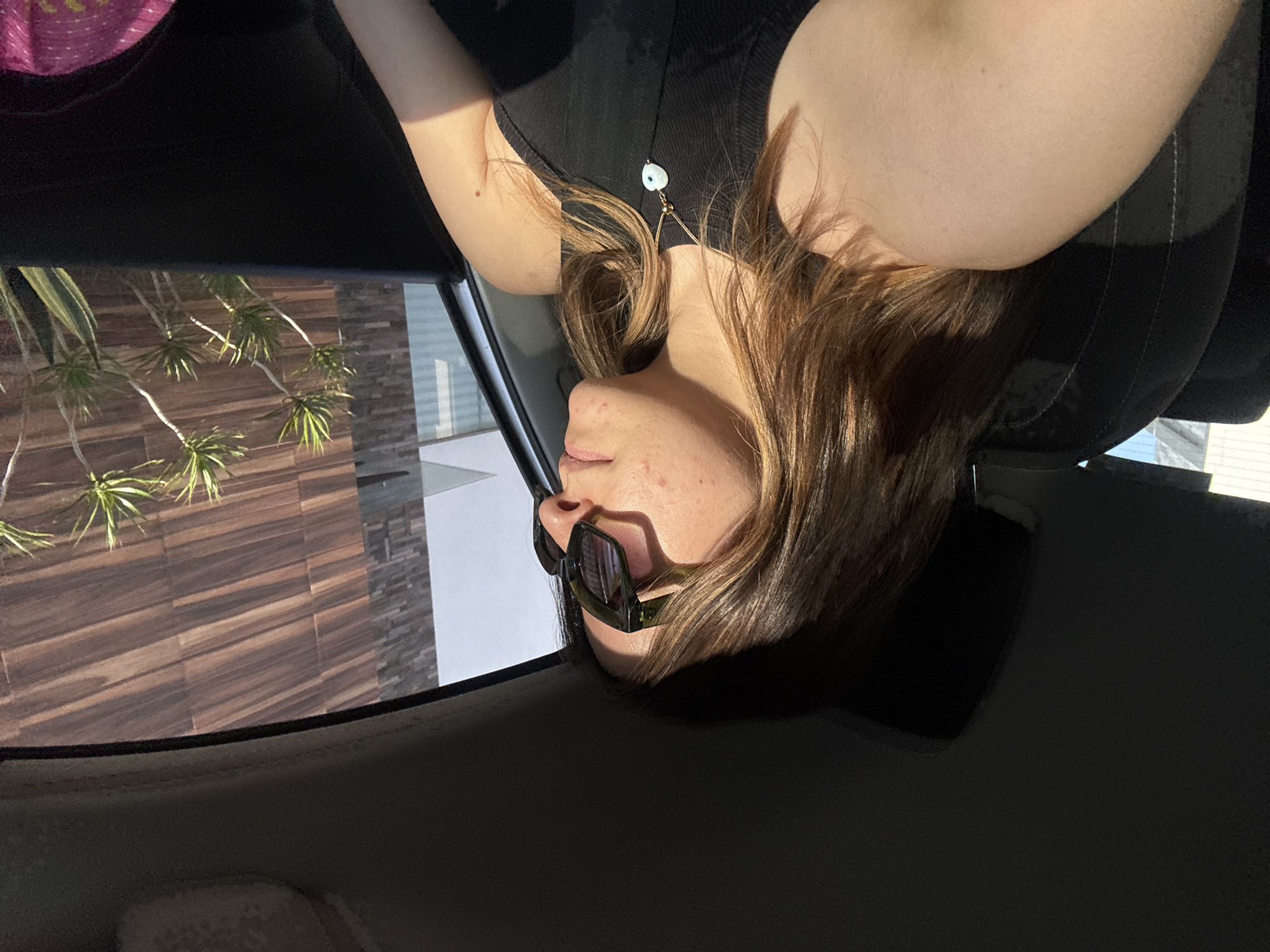 Young woman photographed in vehicle interior, Puebla Mexico