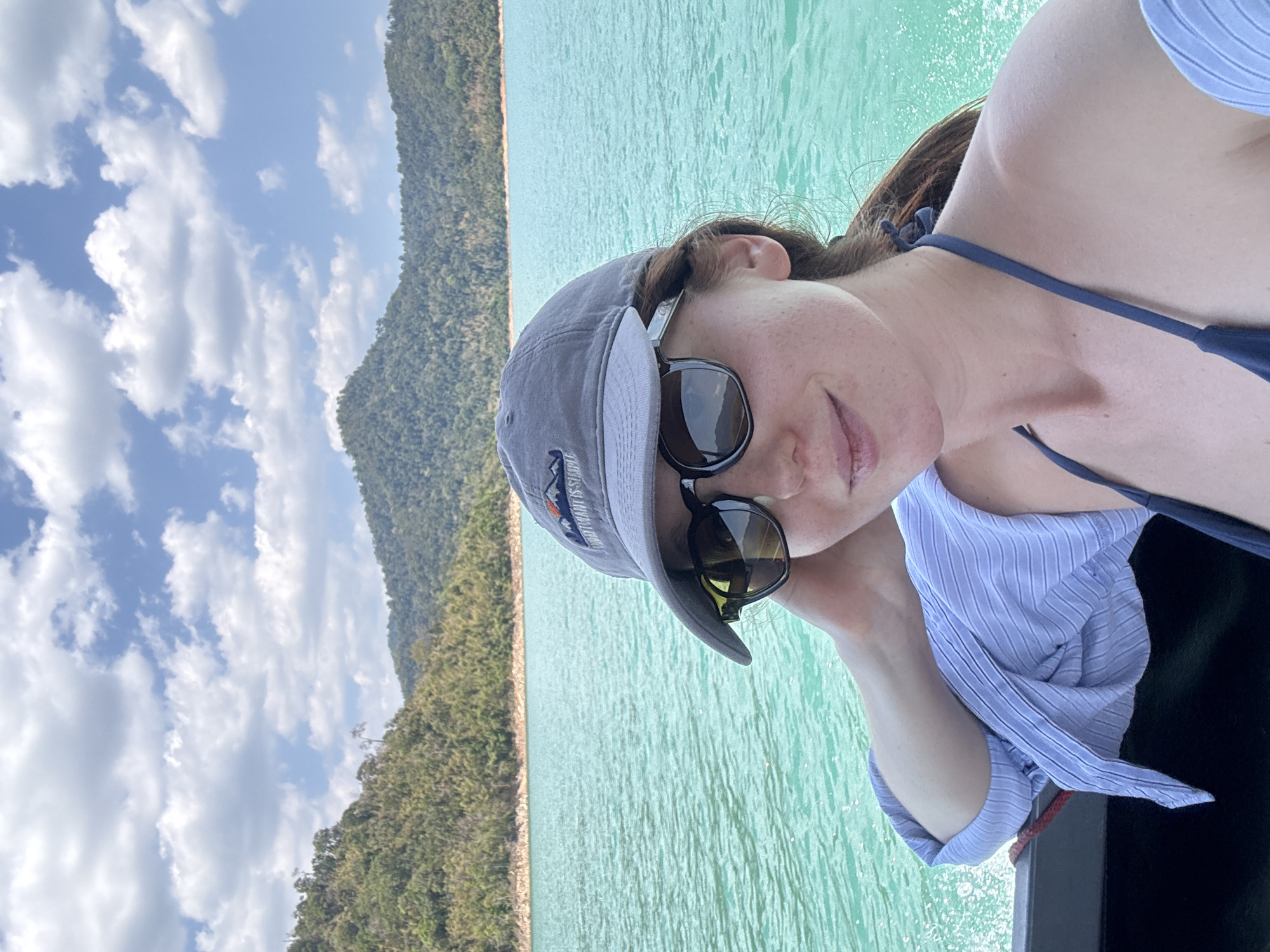 Woman takes selfie while boating on Thailand's Cheow Lan Lake