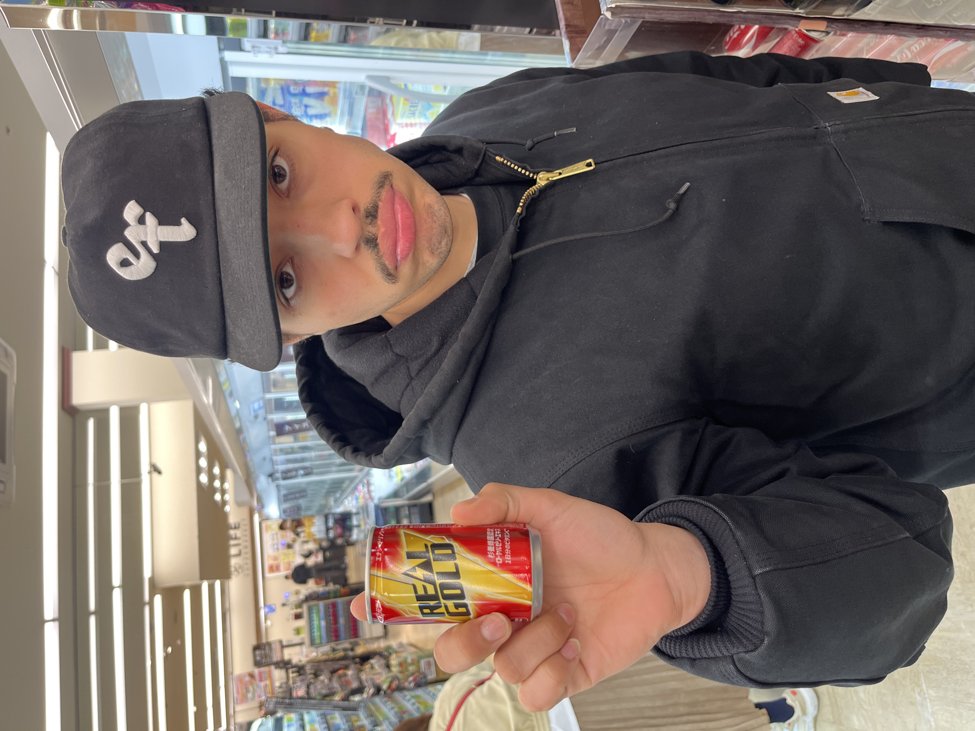 Shopper browses manga-themed beverages at Nakano convenience store