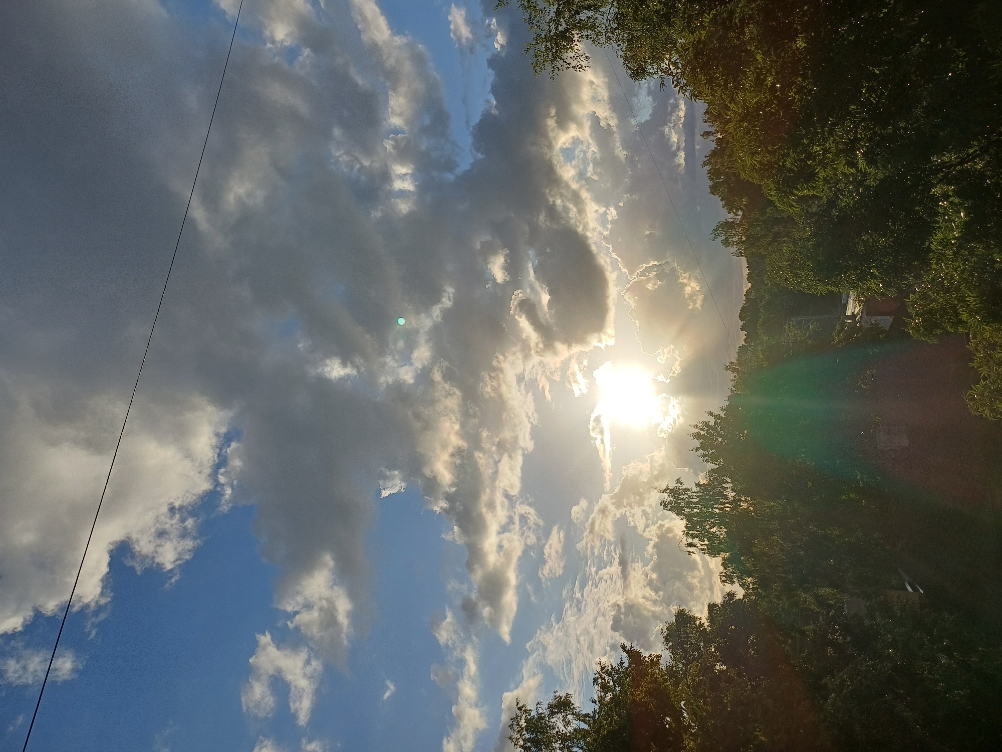 Evening sun breaks through dramatic clouds over Riga