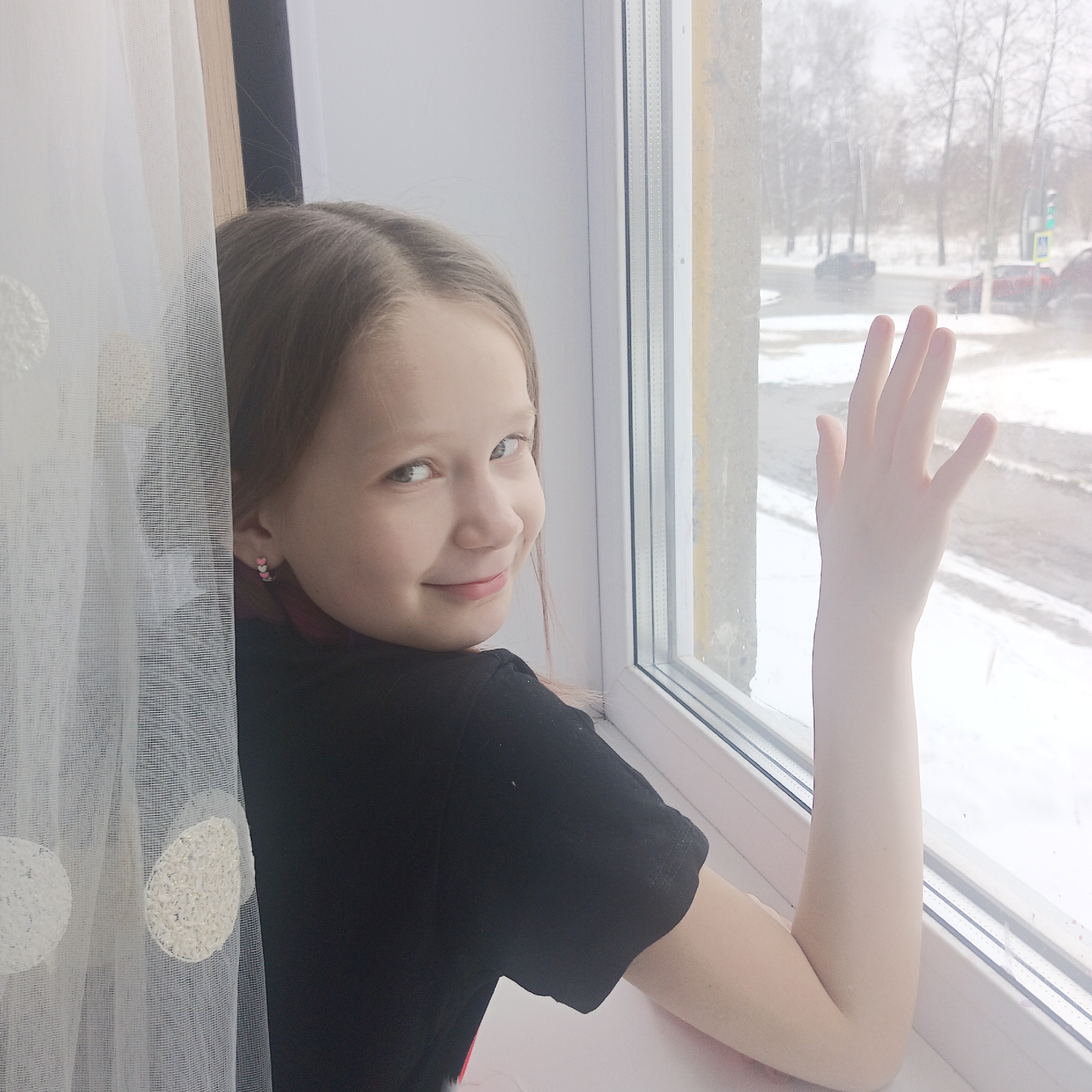 Woman photographed during snowfall in Chaikovsky, Russia