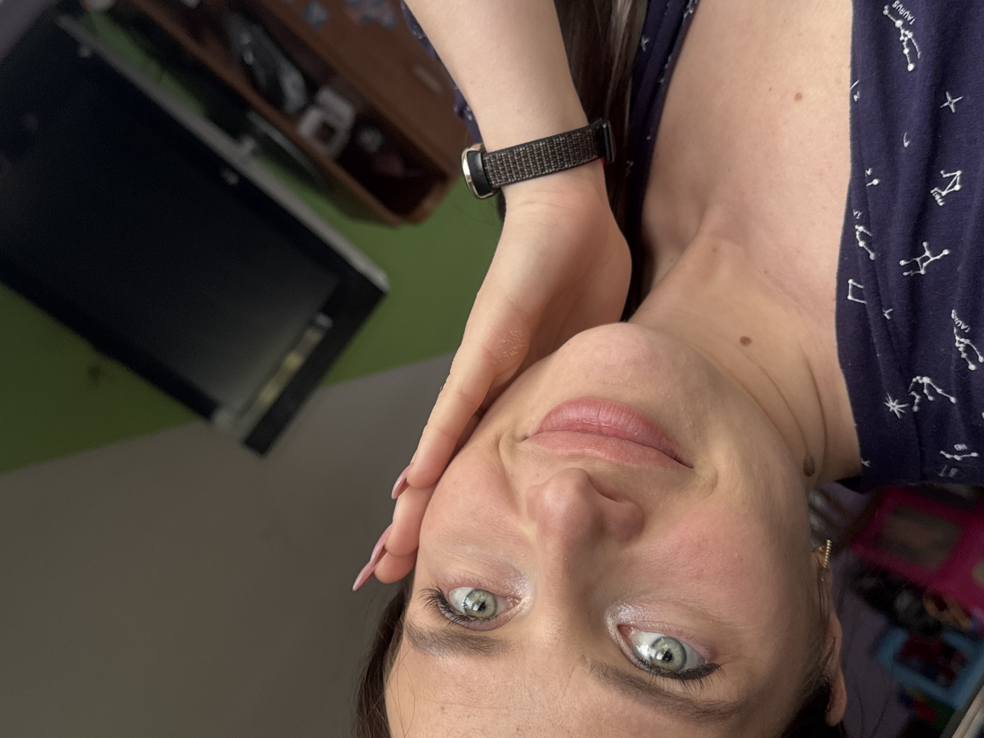 Woman takes selfie in constellation-patterned top in Rusalevka, Russia