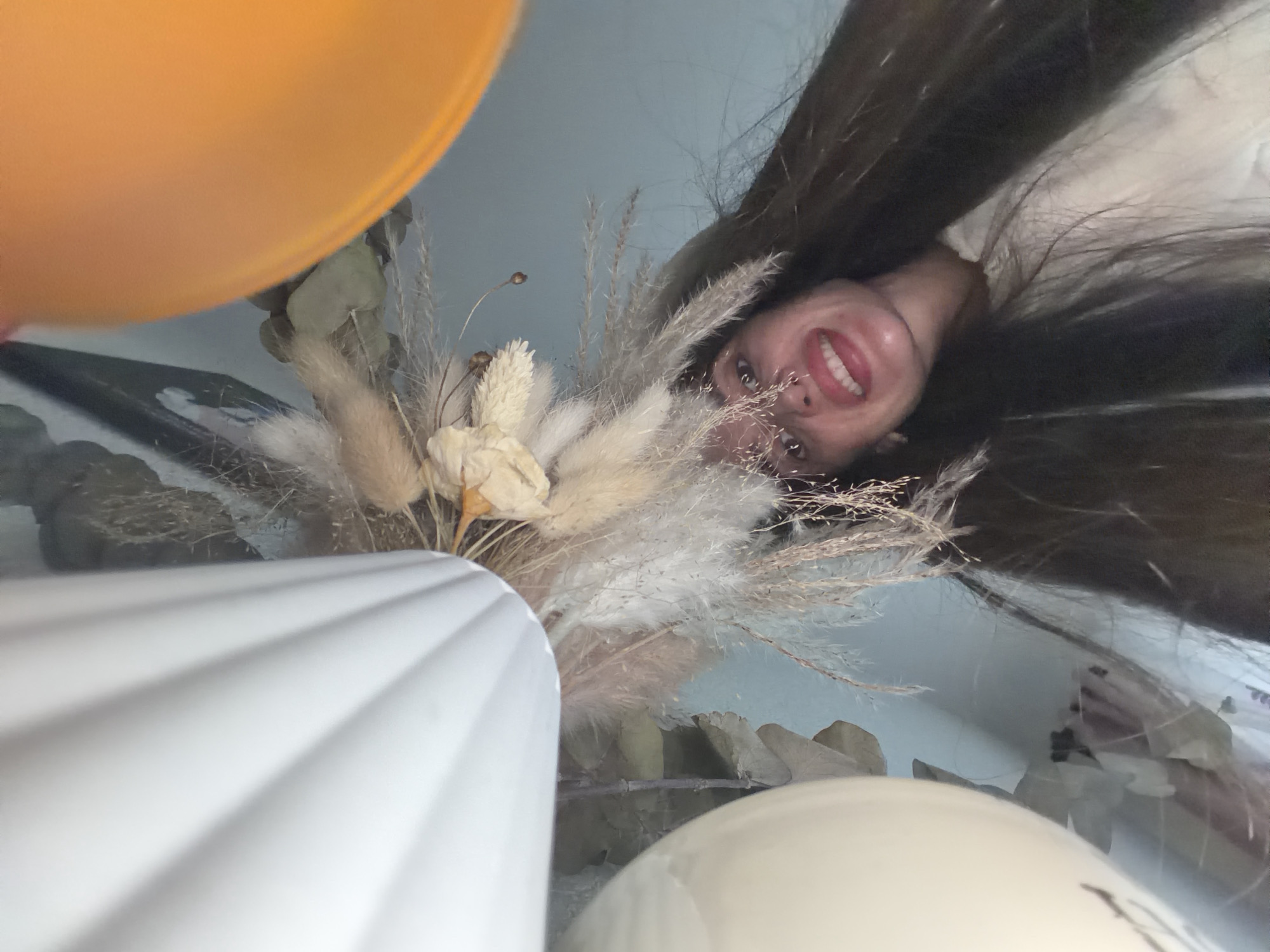 Person takes selfies, holds paper astronaut in Saint Petersburg