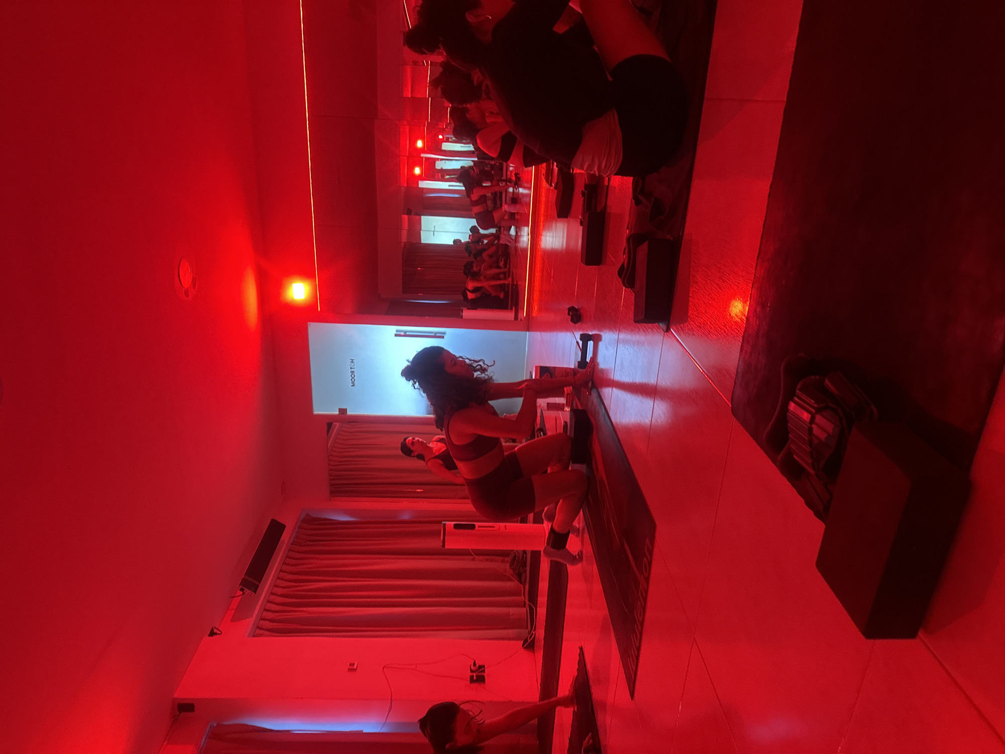Red-lit exercise studio documented in Puebla, Mexico