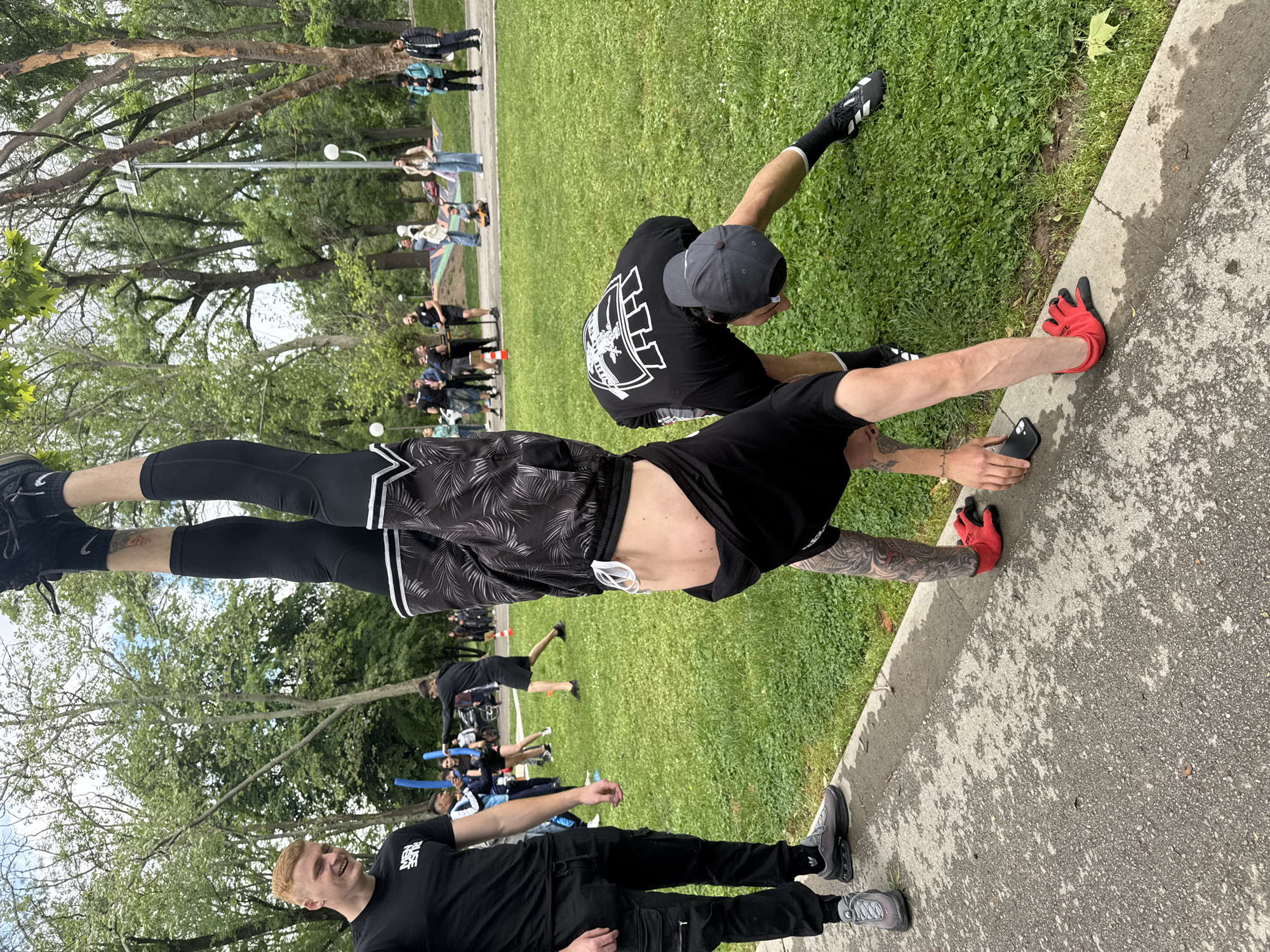 Park gatherings feature handstand performance and foam sword activities