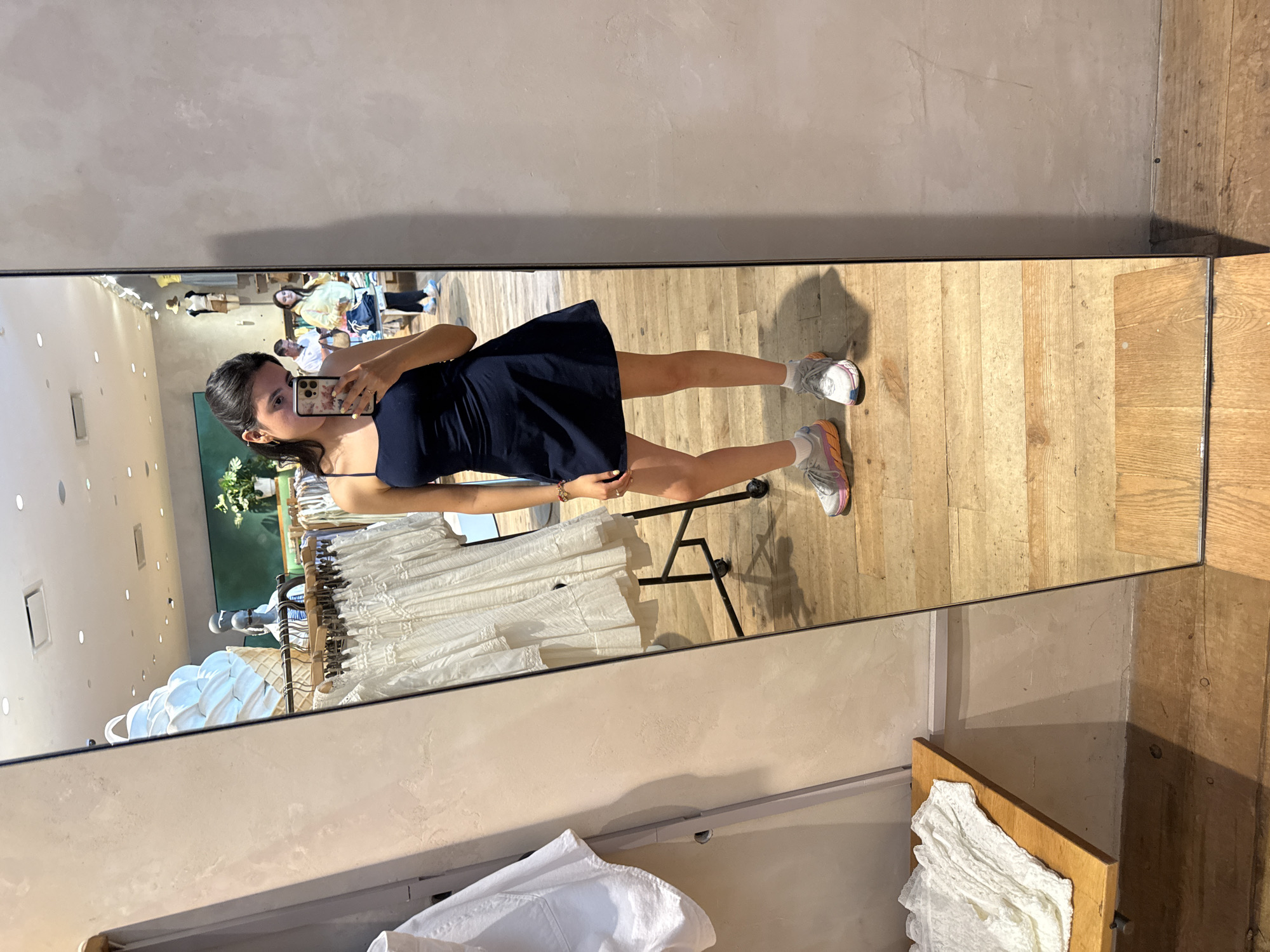 Woman takes mirror selfie while shopping at Austin Anthropologie