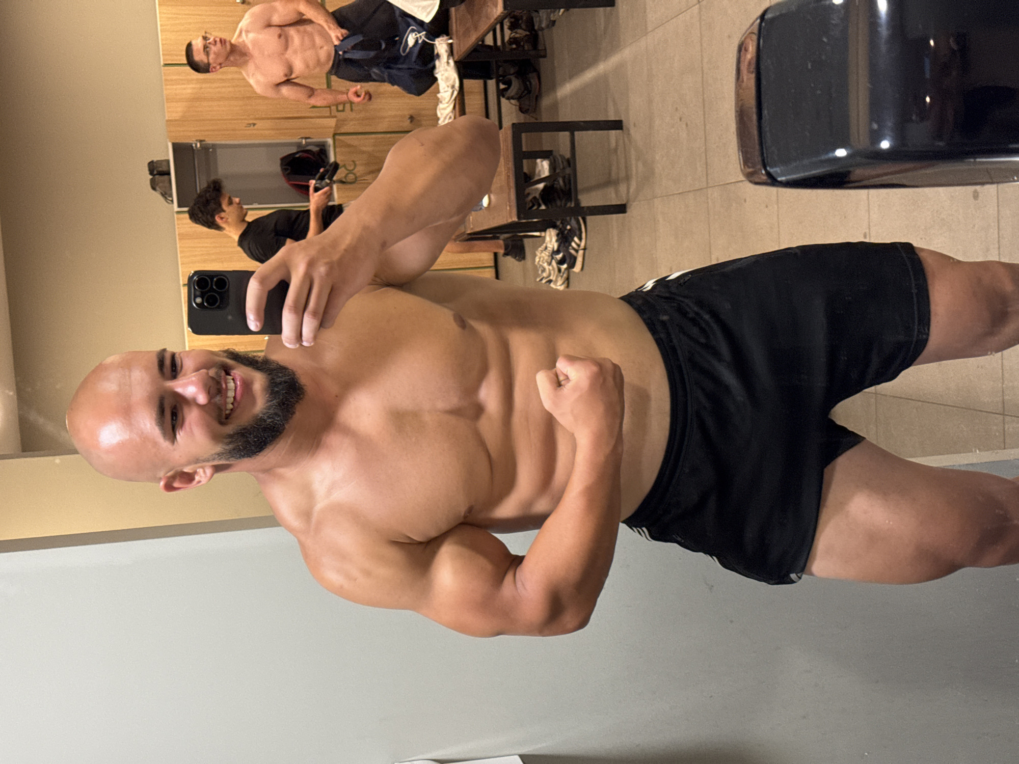 Post-workout mirror selfies in a Sofia gym locker room