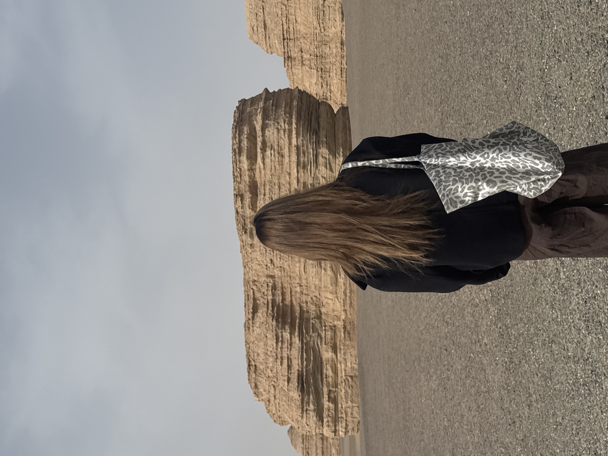 Woman spotted walking through Dunhuang desert landscape