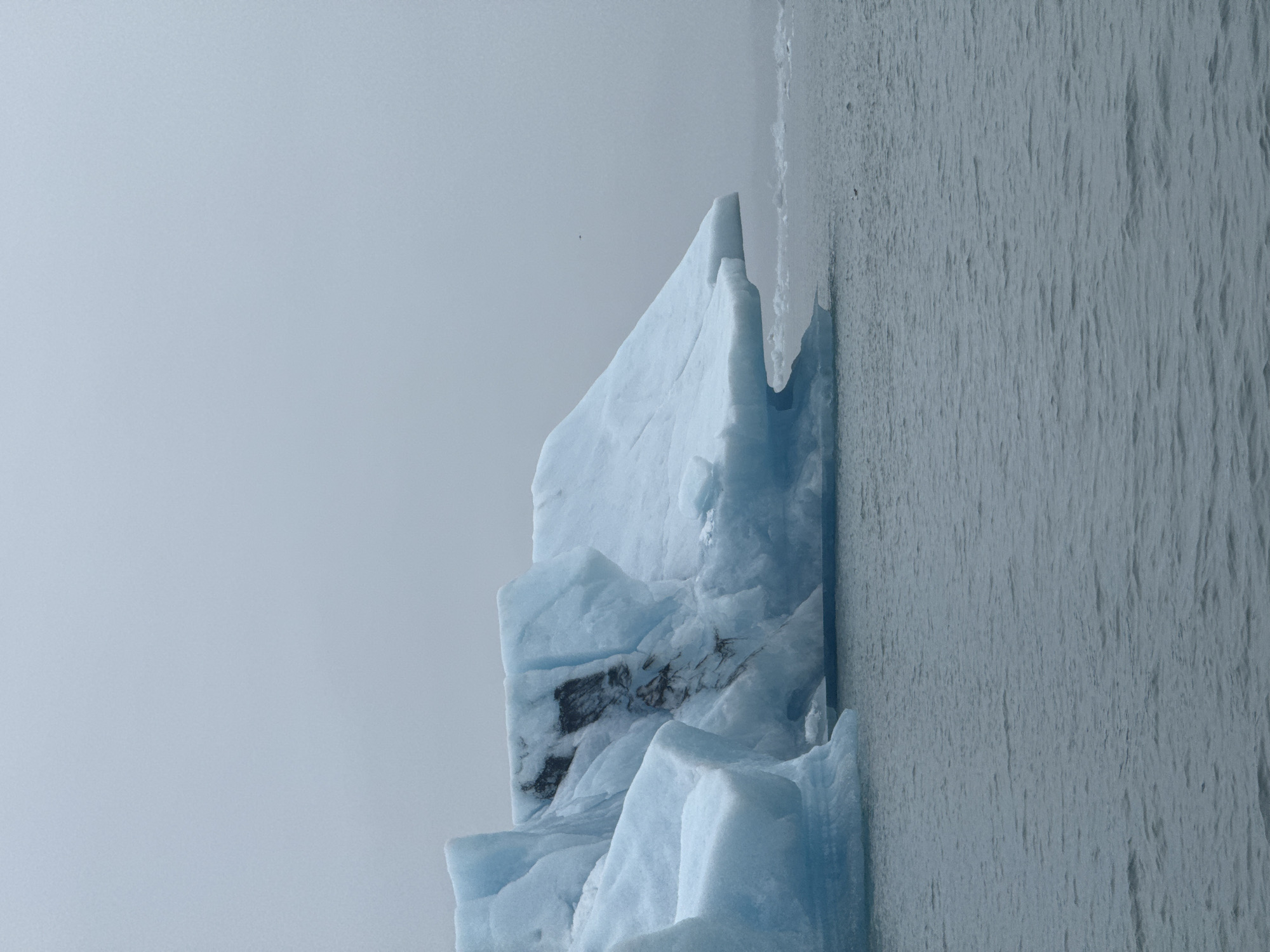 Tourists explore icebergs at Iceland's Jokulsarlon glacial lagoon