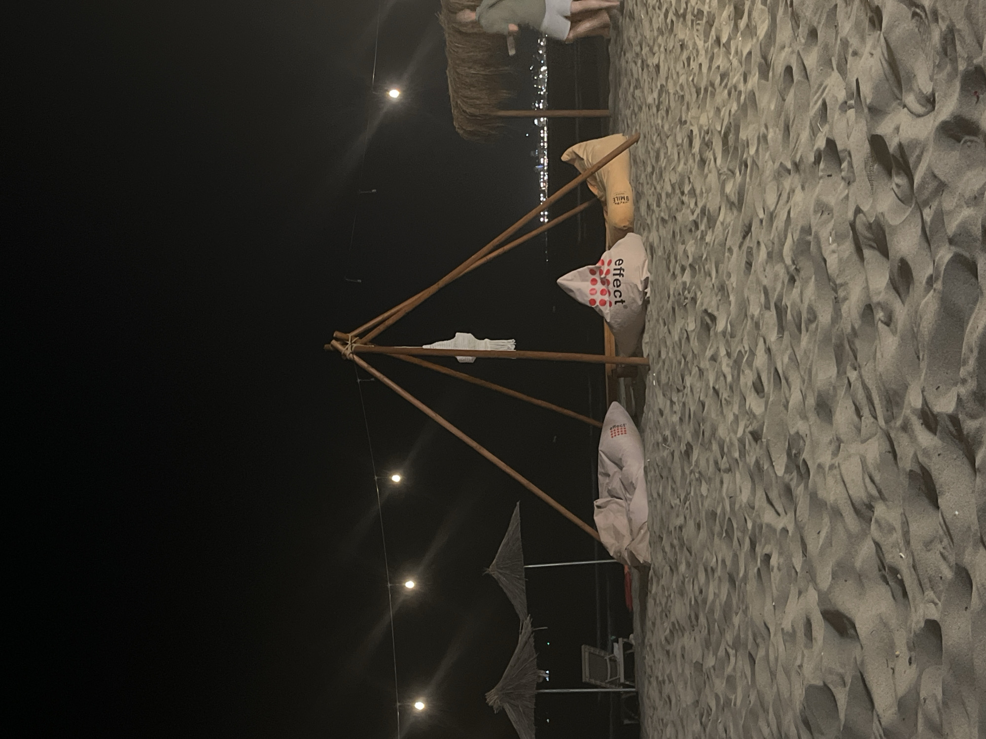 Beach lounge night in Durrës, hookahs and string lights