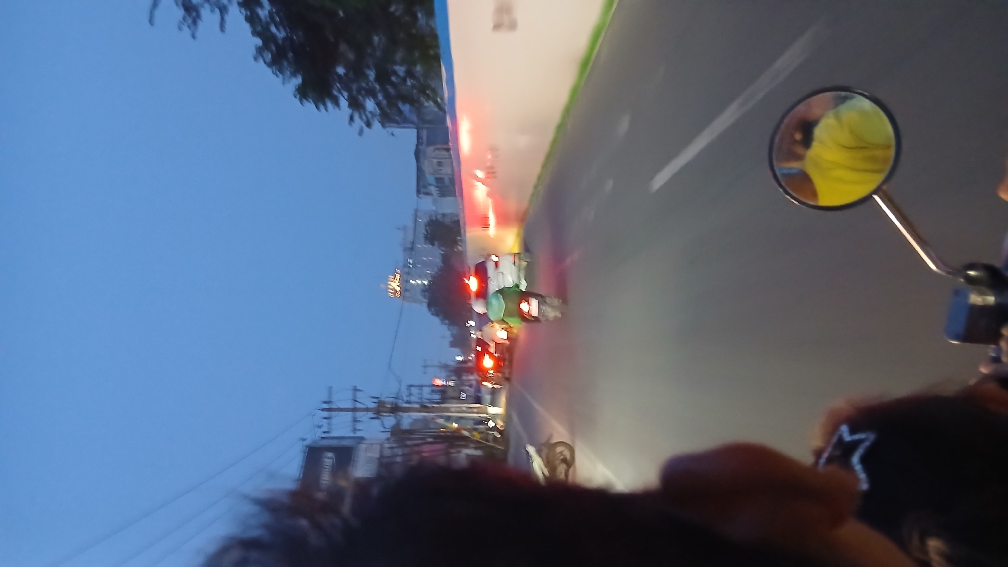 Motorcycle POV through Medan streets at twilight