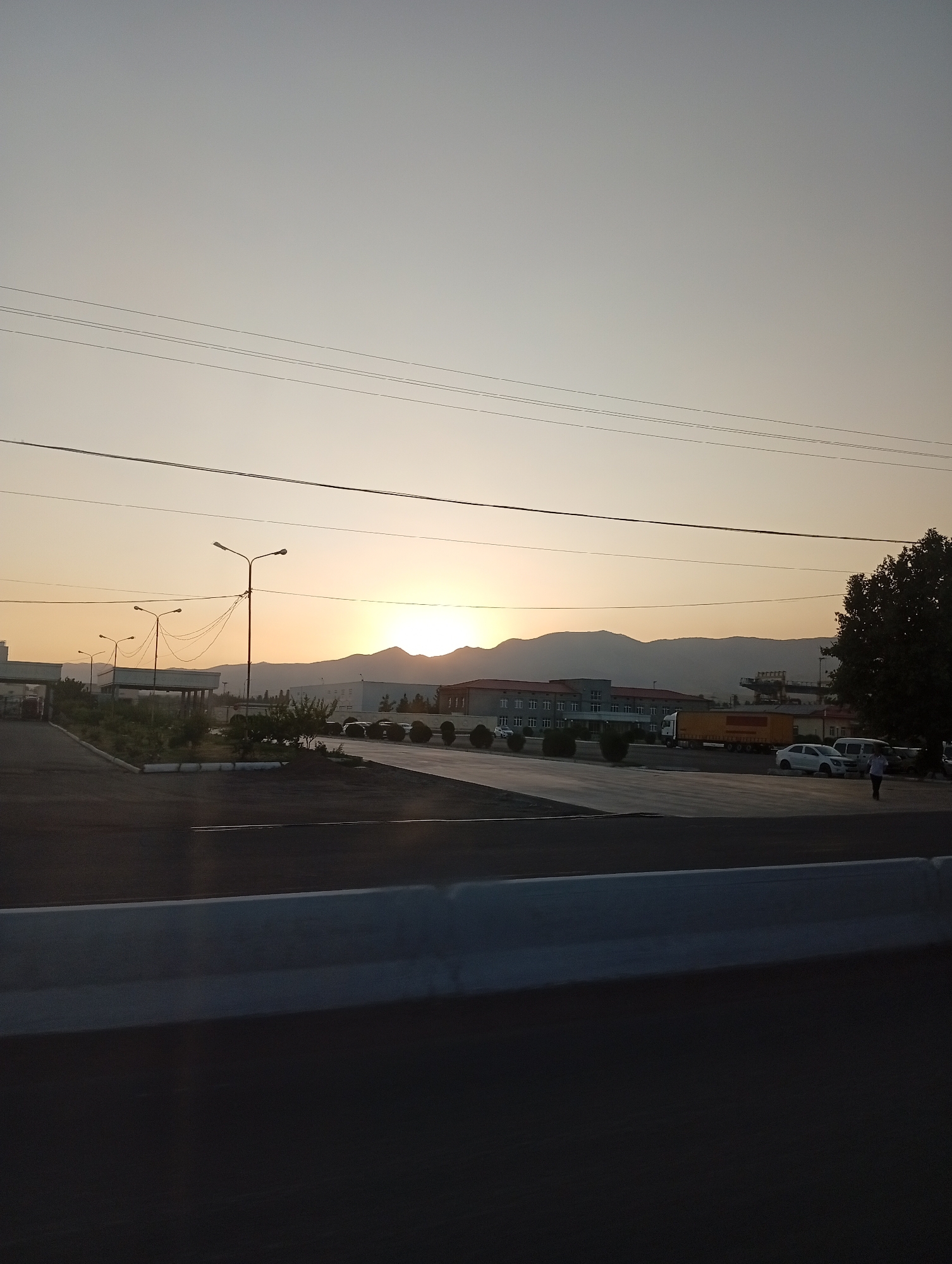 Dusk drive along an open road in Angren, Uzbekistan
