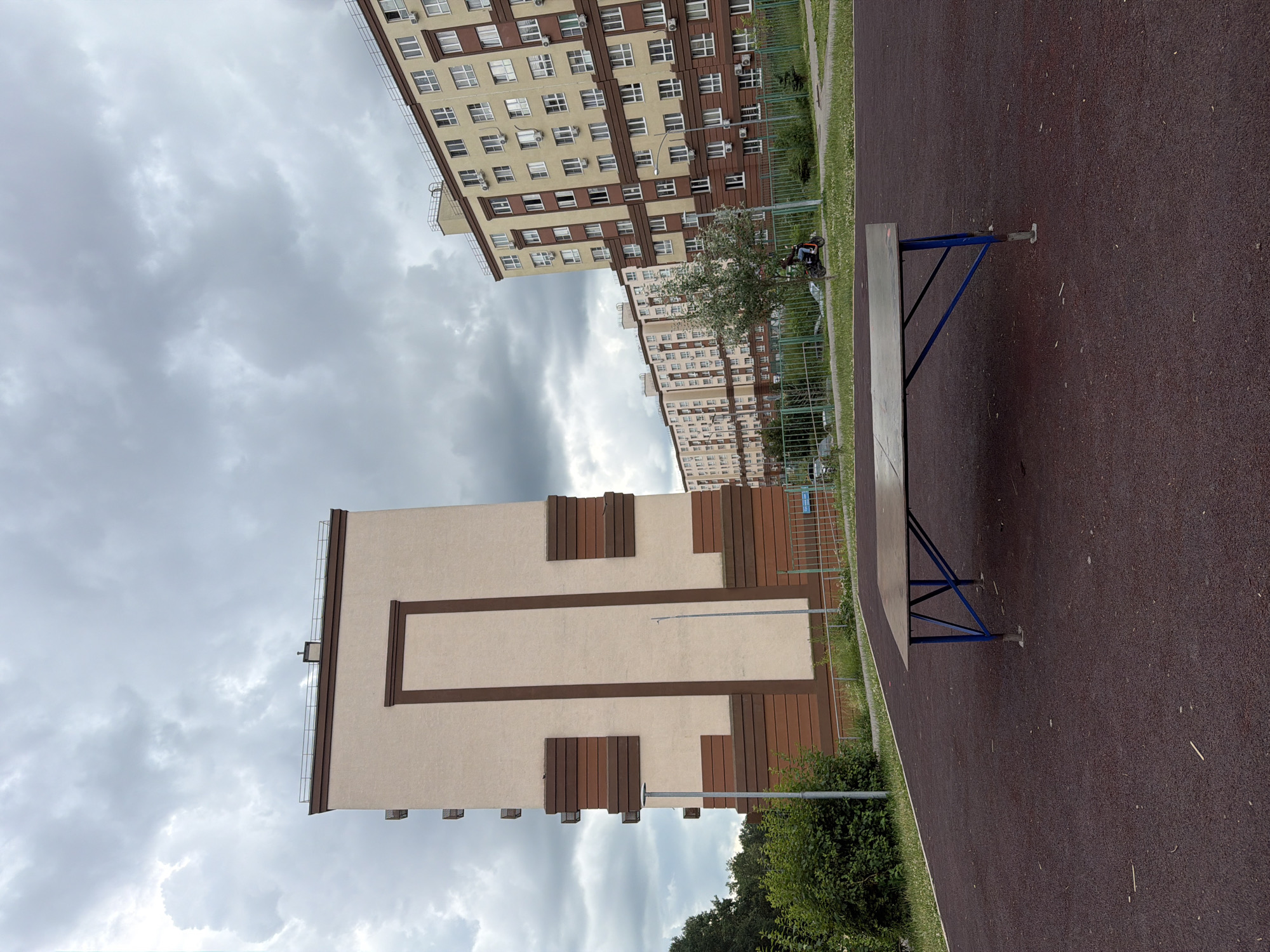 Afternoon in a Lopatino residential courtyard, June 2026