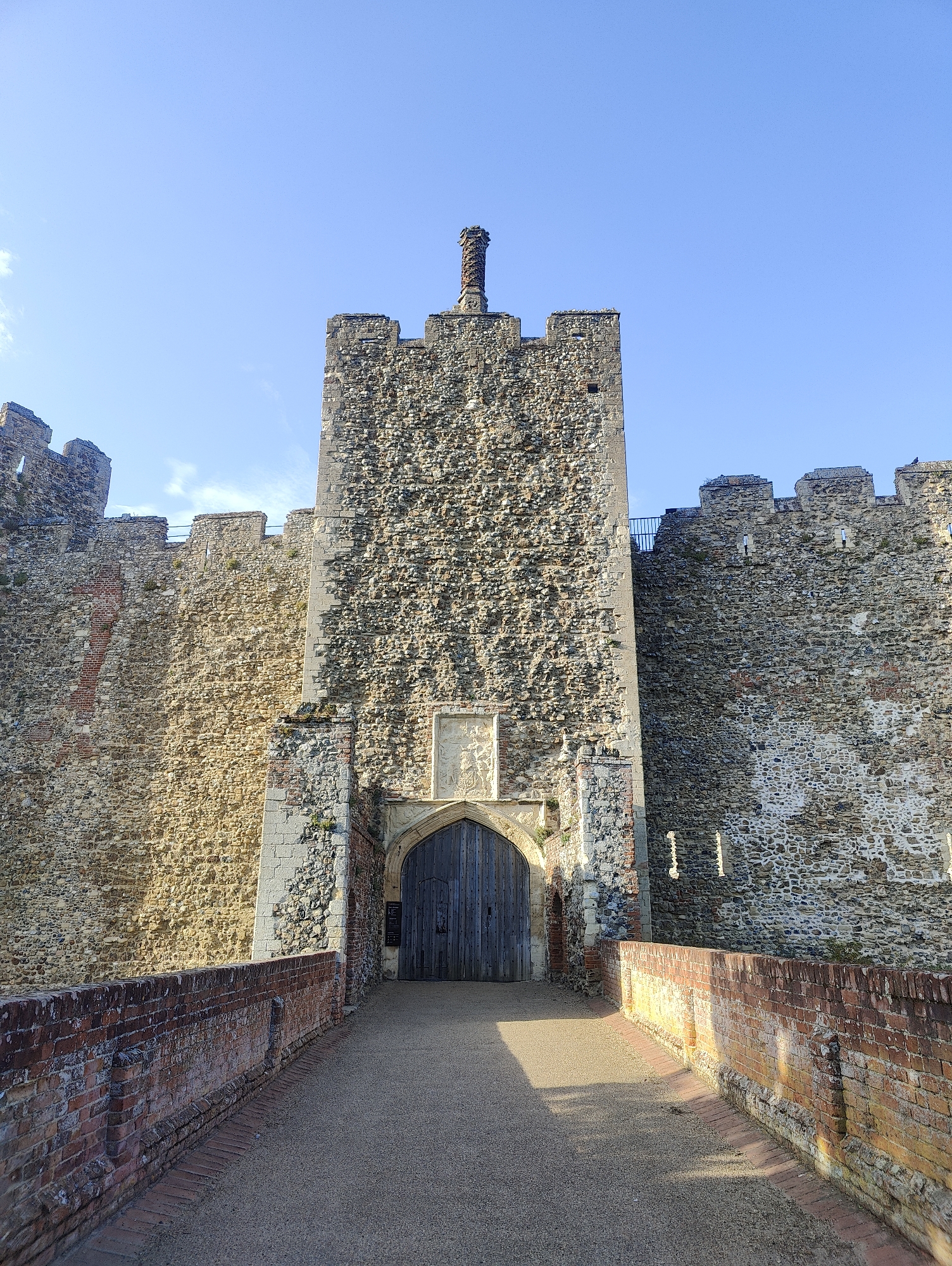 Visitors explore Framlingham Castle grounds during evening hours