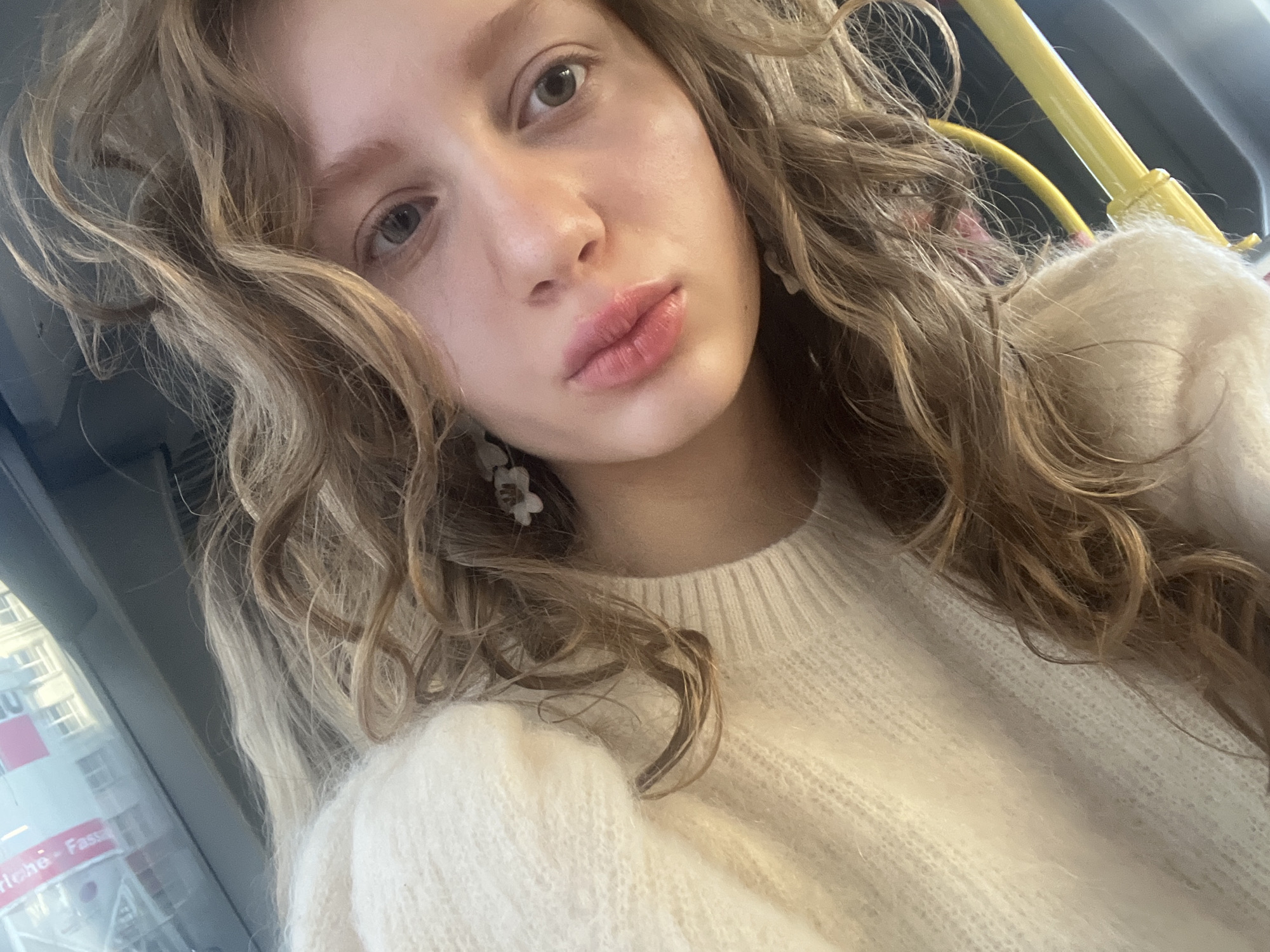 Woman takes early morning selfie on Vienna public transport