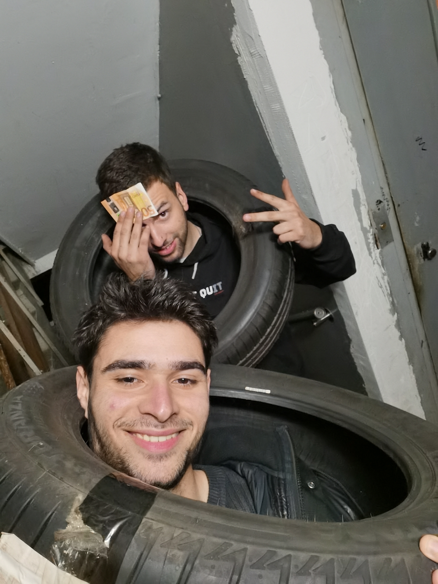 Young men pose playfully in underground garage photos