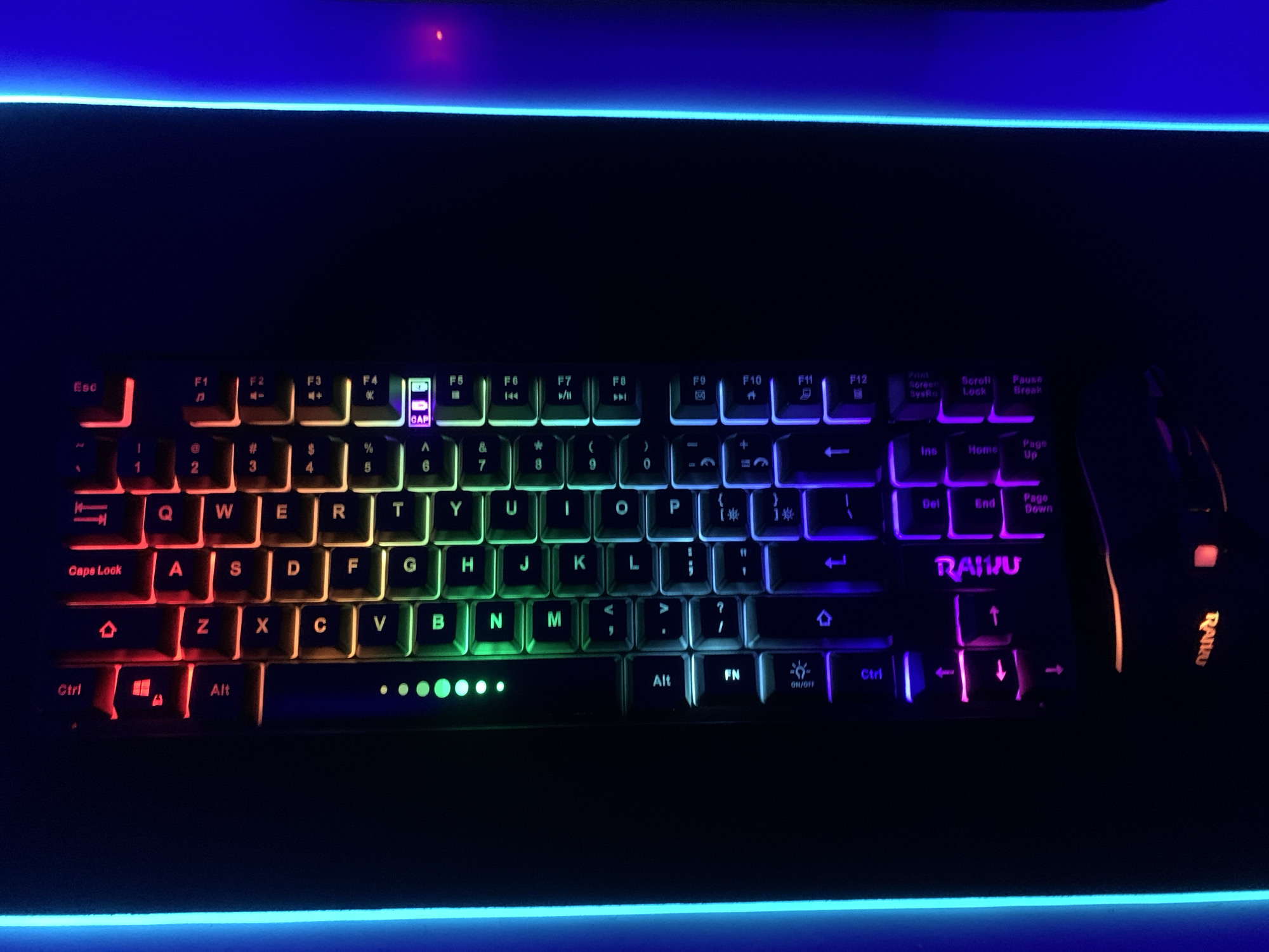 Gaming setup with illuminated mechanical keyboard observed in Lagos