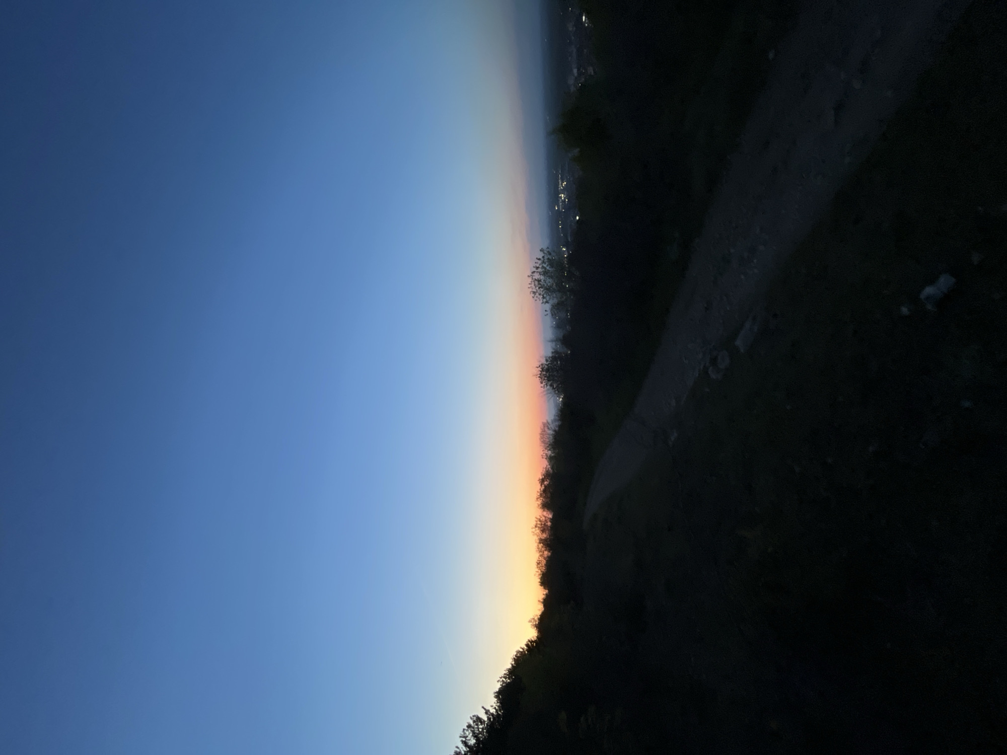 Evening walker captured on hillside path overlooking Asenovgrad