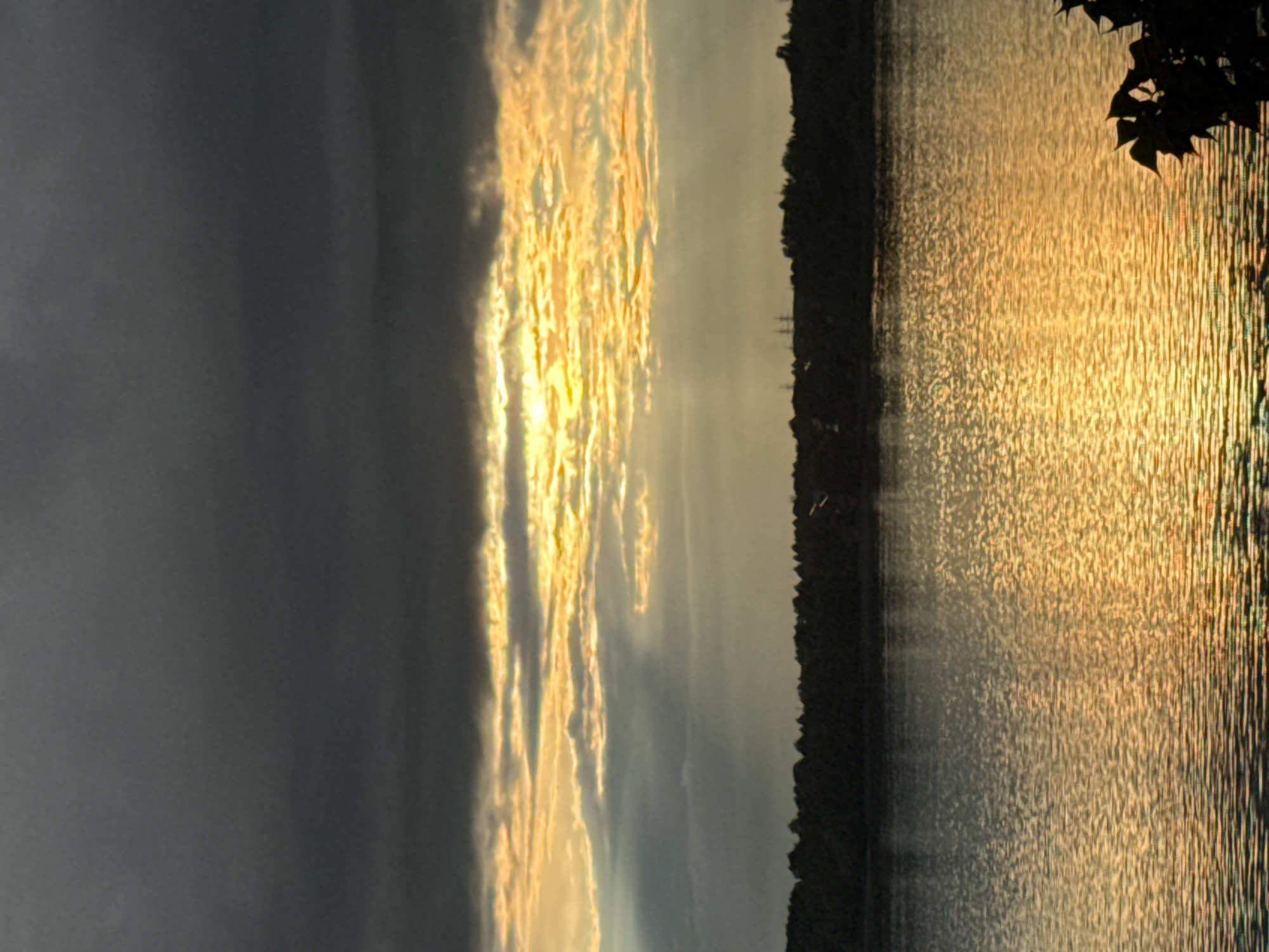 Dramatic sunrise/sunset captured over water near Noviy, Russia