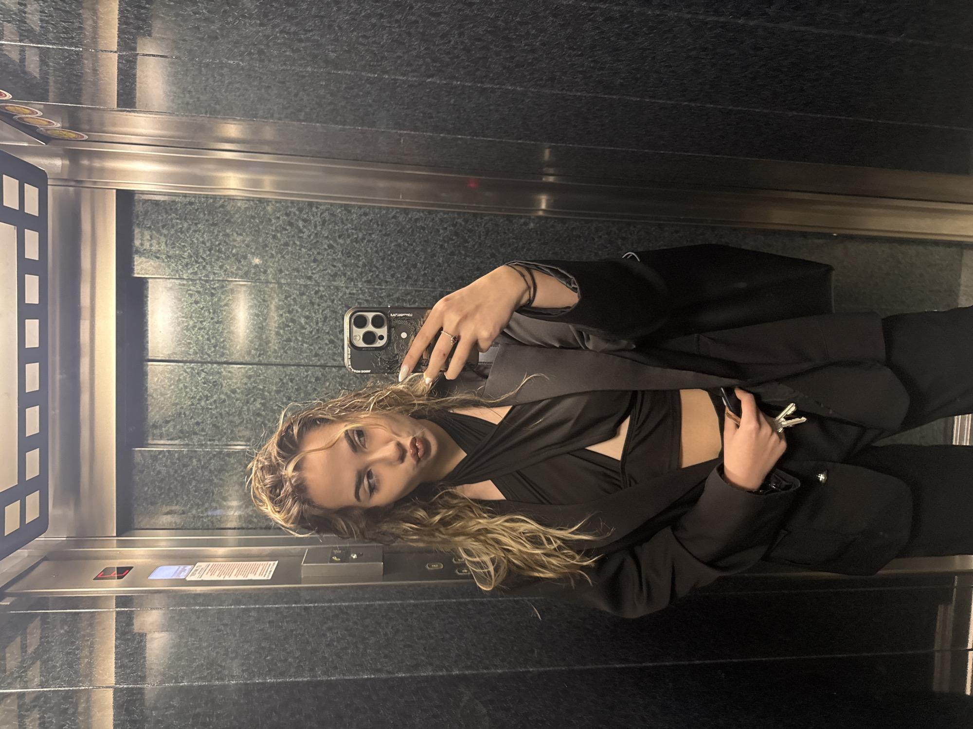 Woman takes selfies with rose in Blagoevgrad elevator, street