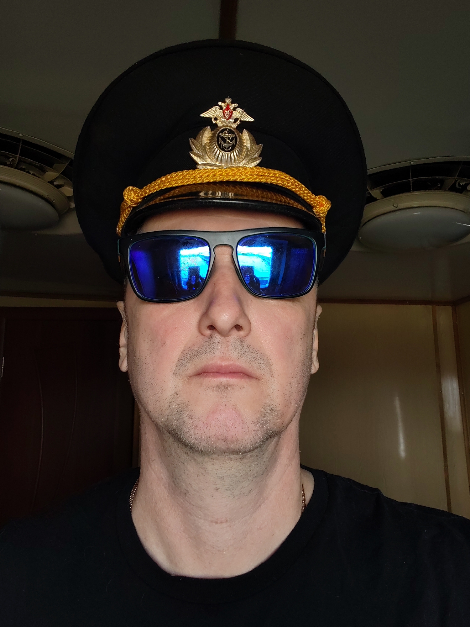Man in military cap photographed in formal portrait