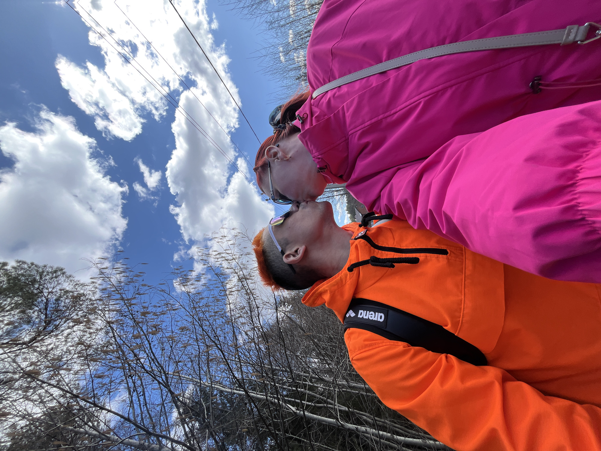 Couple enjoys outdoor stroll with baby in Chaikovsky