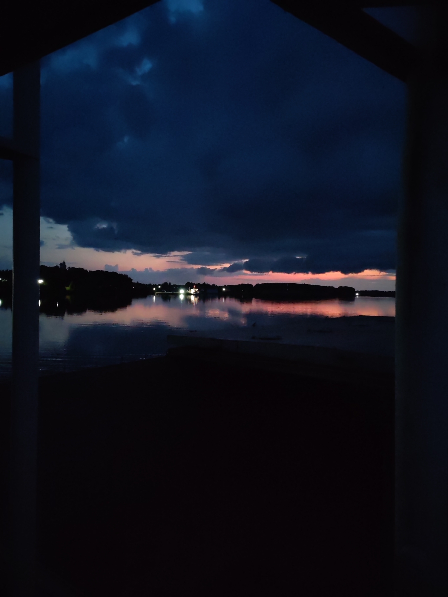 Twilight storm clouds gathering over a Russian lake or river