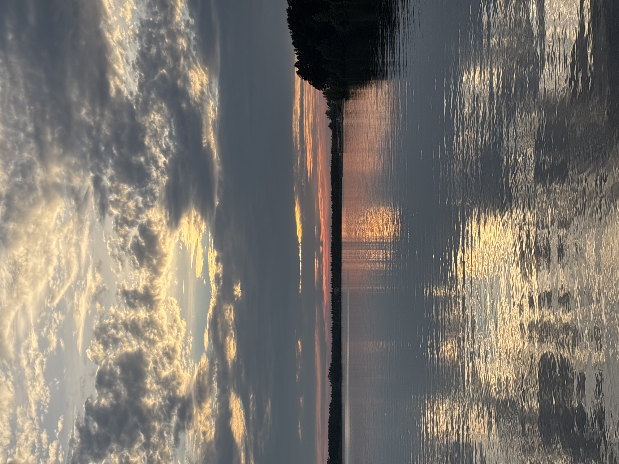 Sunset reflections on still water outside Zheleznogorsk